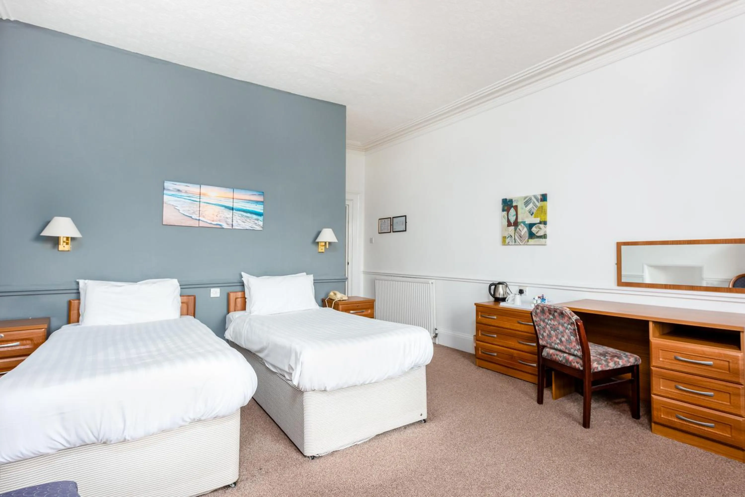 Bed in Abbey Lawn Hotel