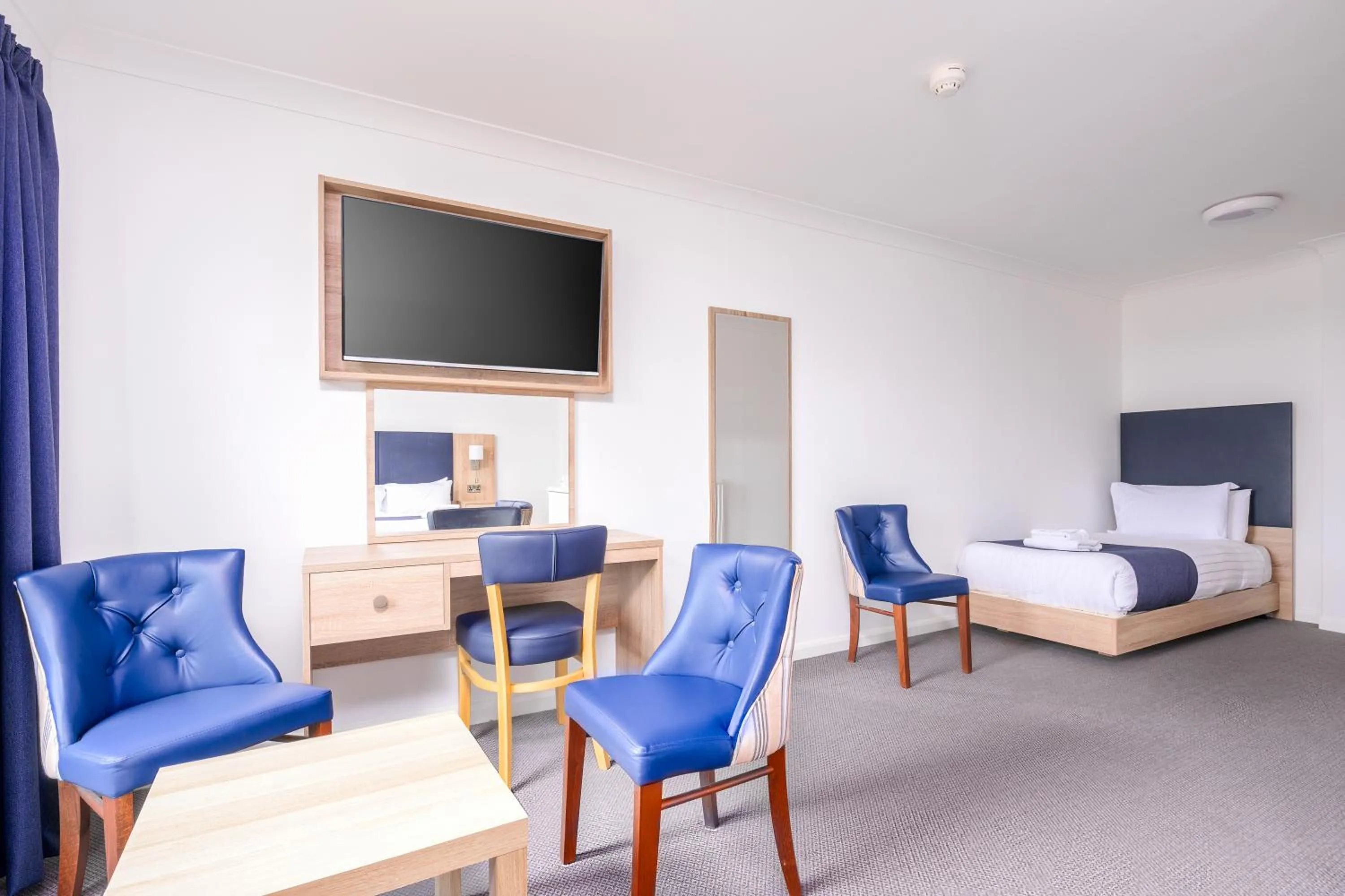 Bed in Abbey Lawn Hotel