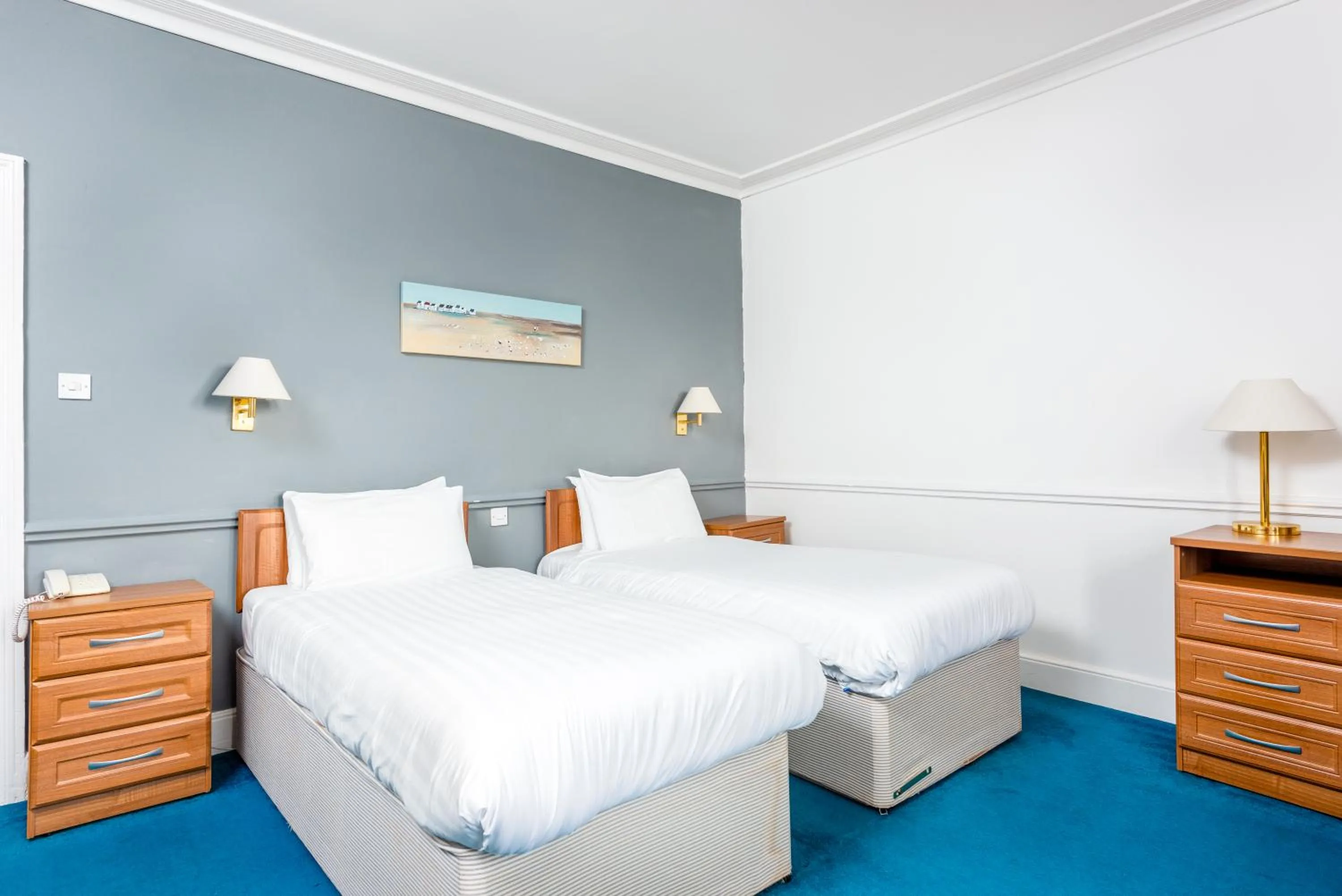 Bed in Abbey Lawn Hotel