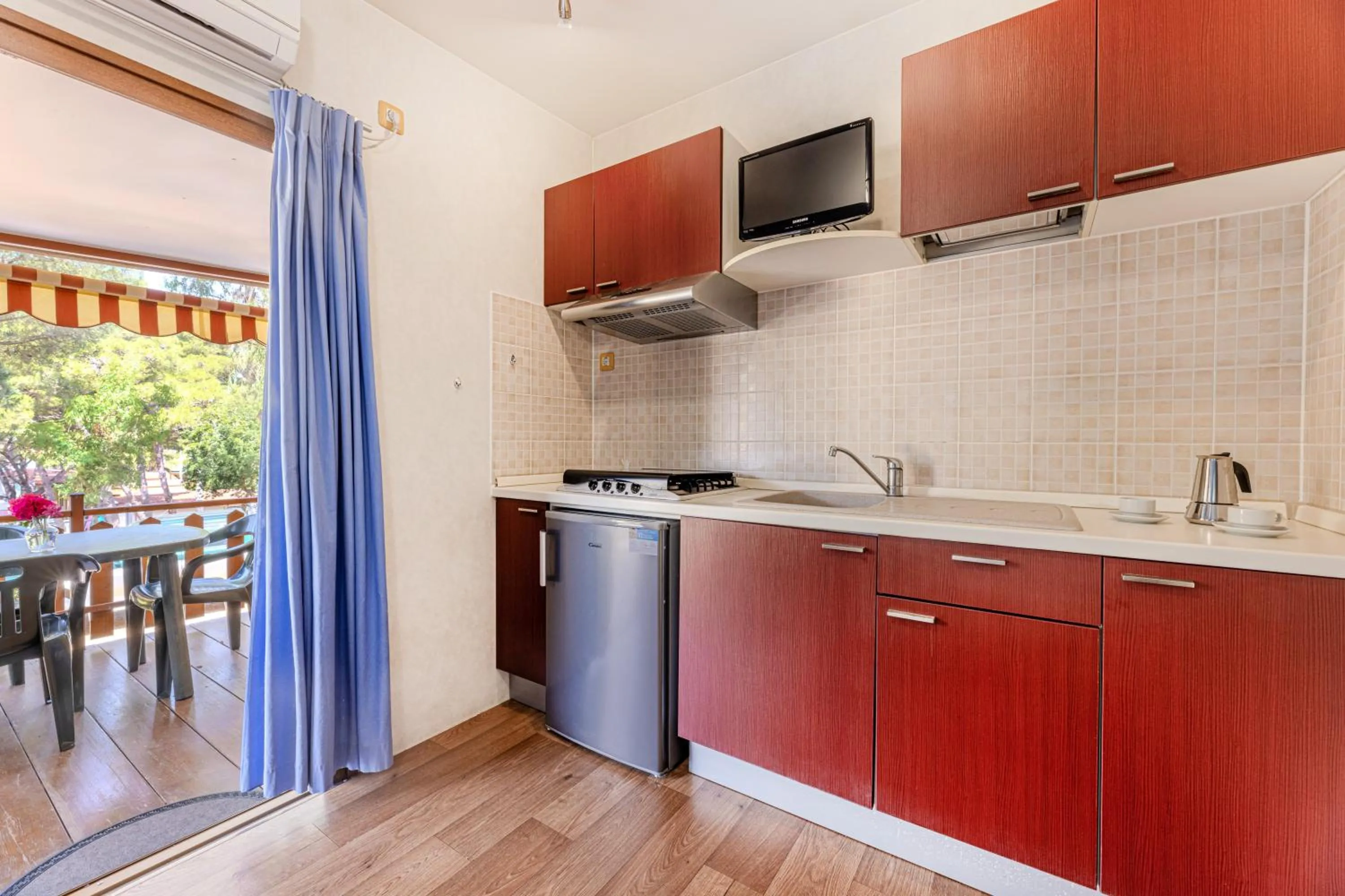 Kitchen or kitchenette in Camping Village Le Calanchiole