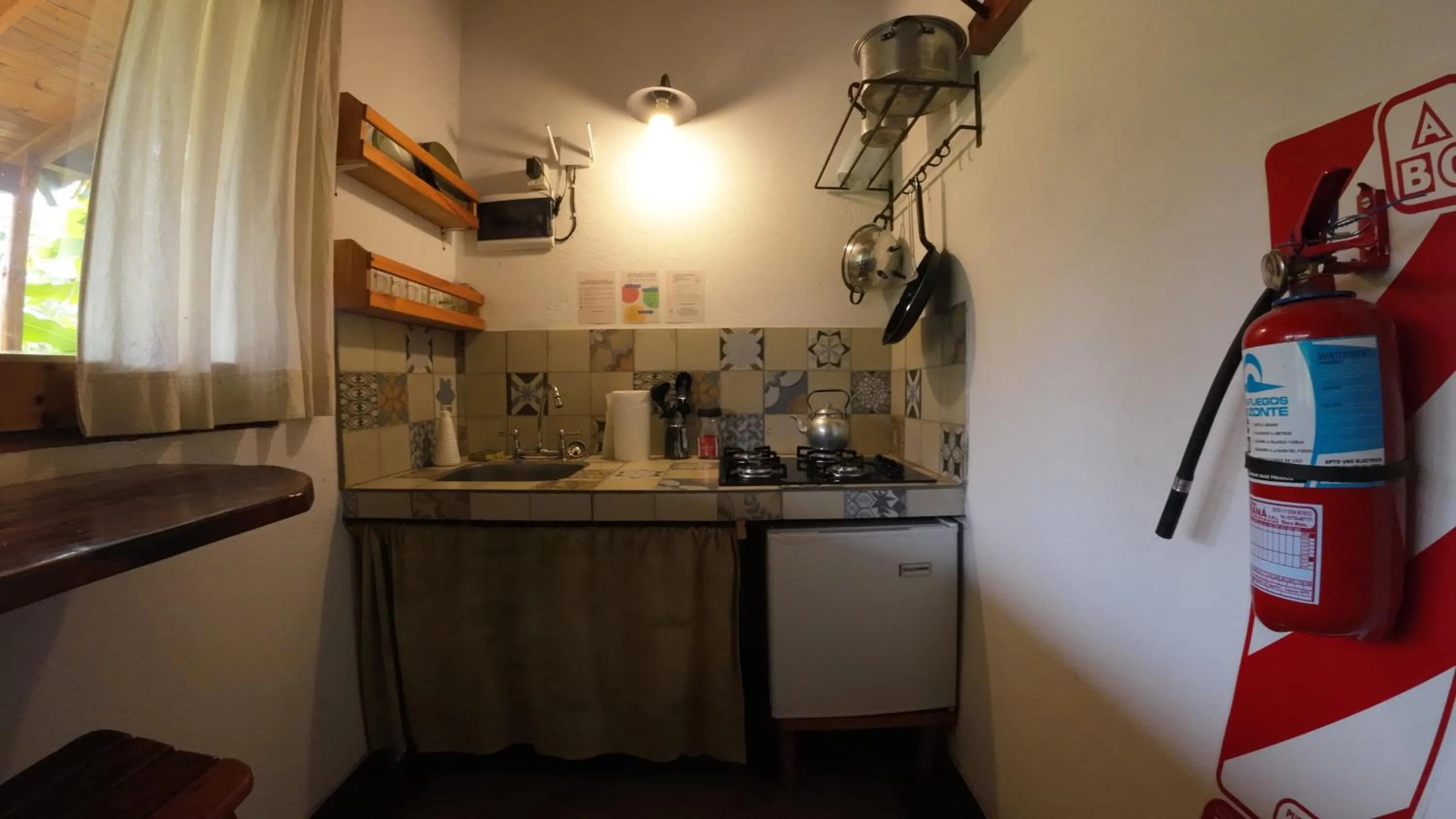 Kitchen or kitchenette in Granja La Lechuza Ecolodge