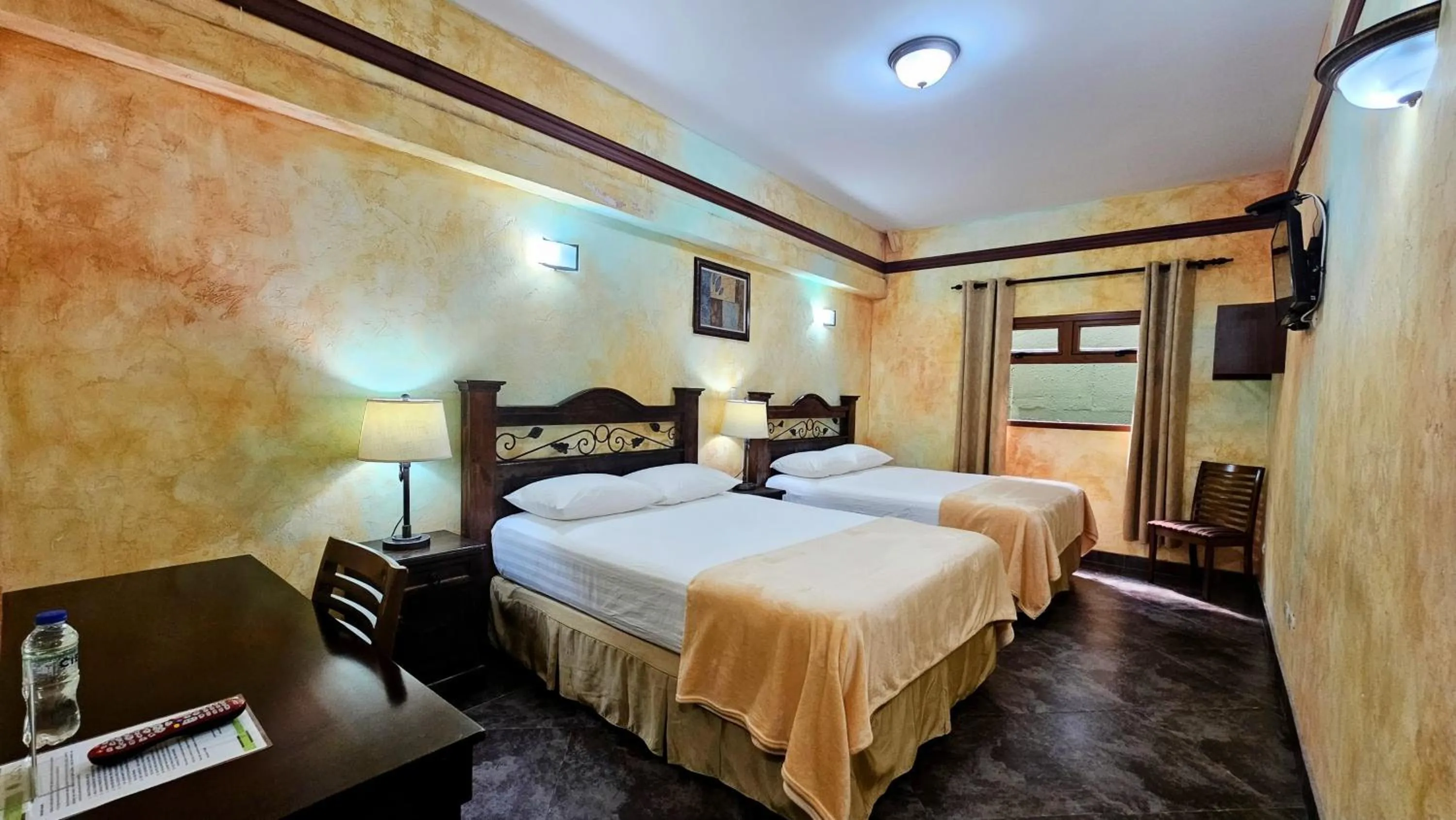 Bed in Antigua Inn Hotel