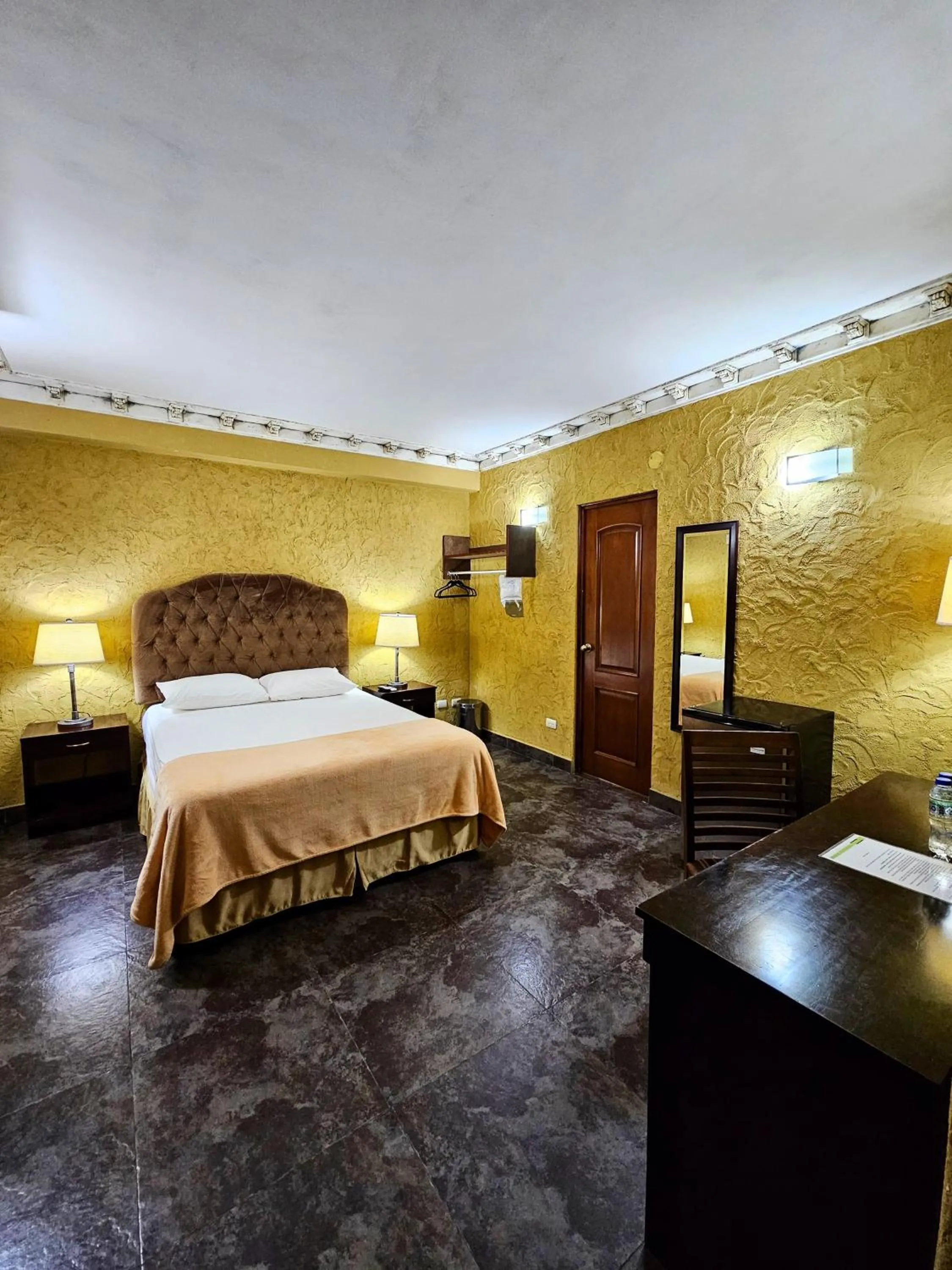 Bed in Antigua Inn Hotel