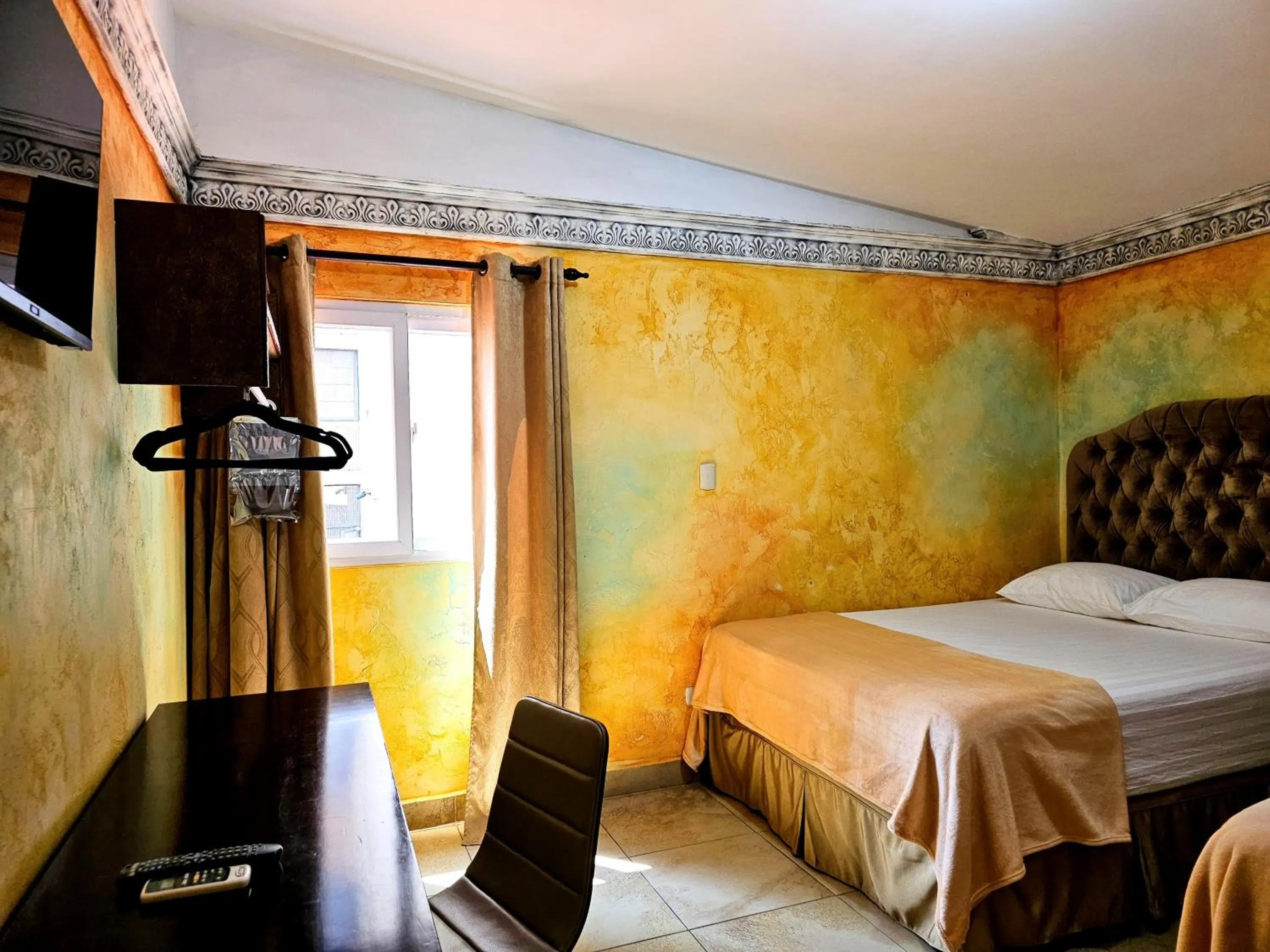 Bed in Antigua Inn Hotel