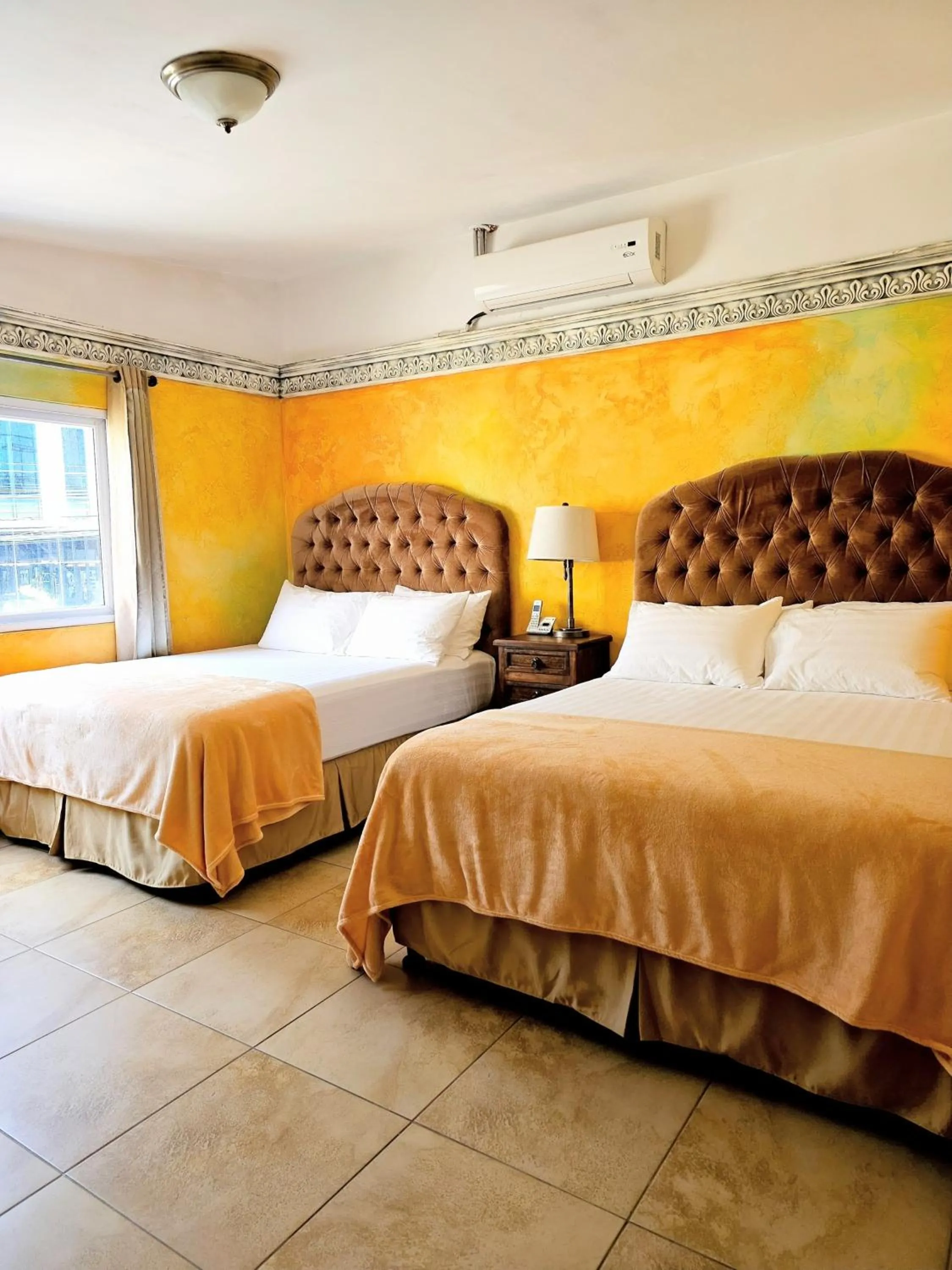 Bed in Antigua Inn Hotel