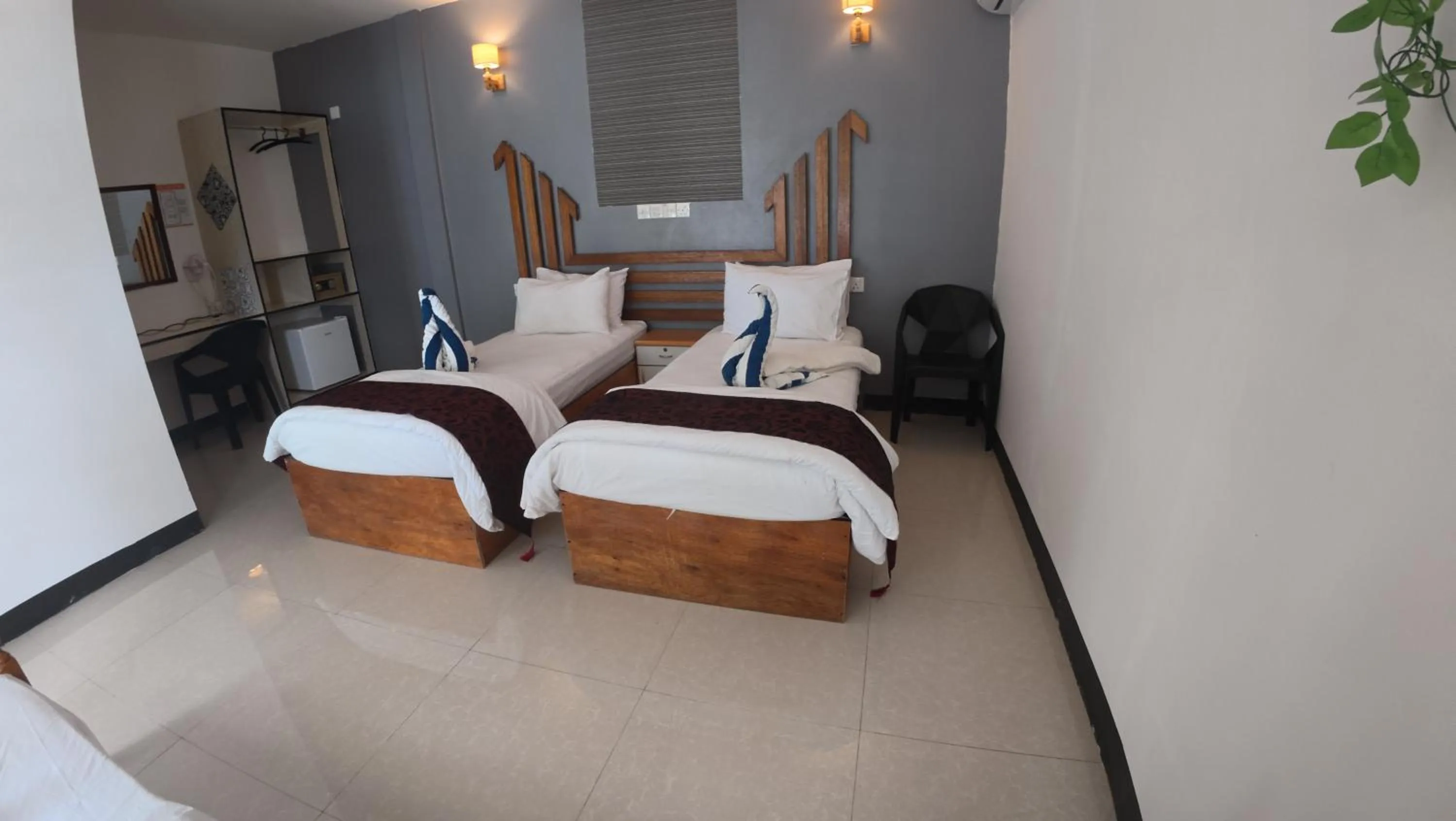 Bed in Liberty Guesthouse Maldives