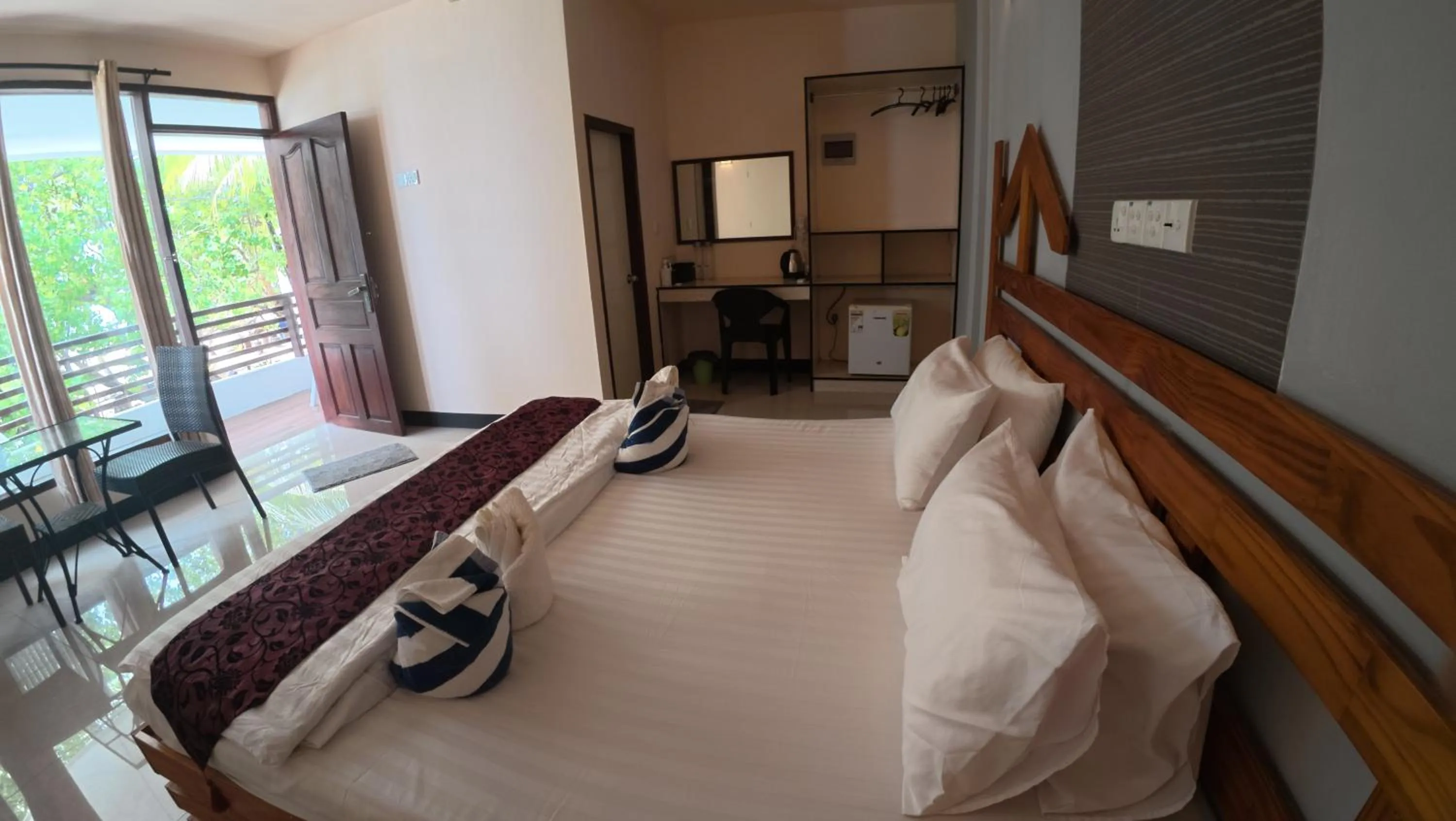 Bed in Liberty Guesthouse Maldives