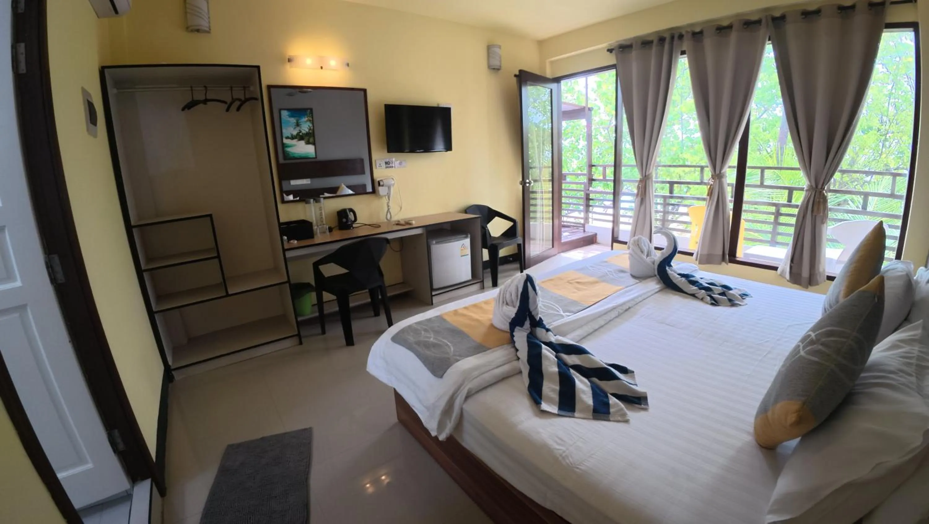 Bed in Liberty Guesthouse Maldives