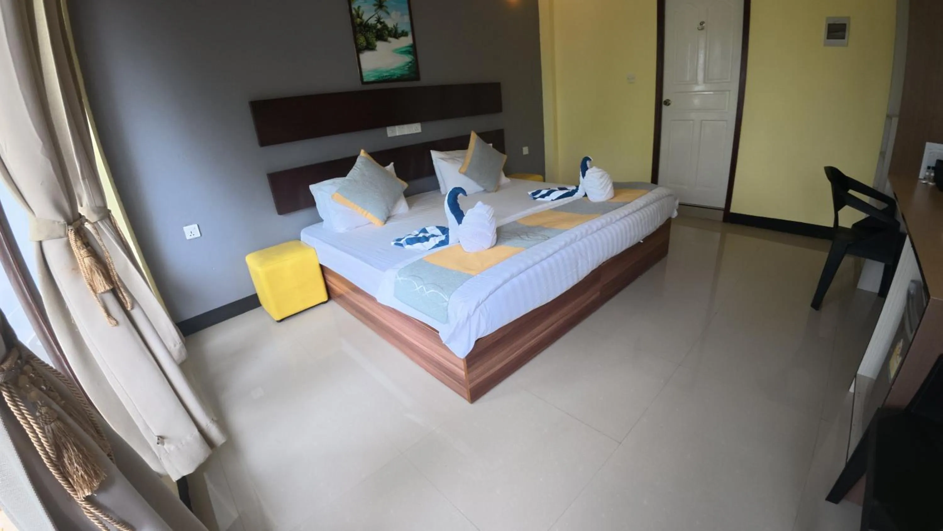 Bed in Liberty Guesthouse Maldives