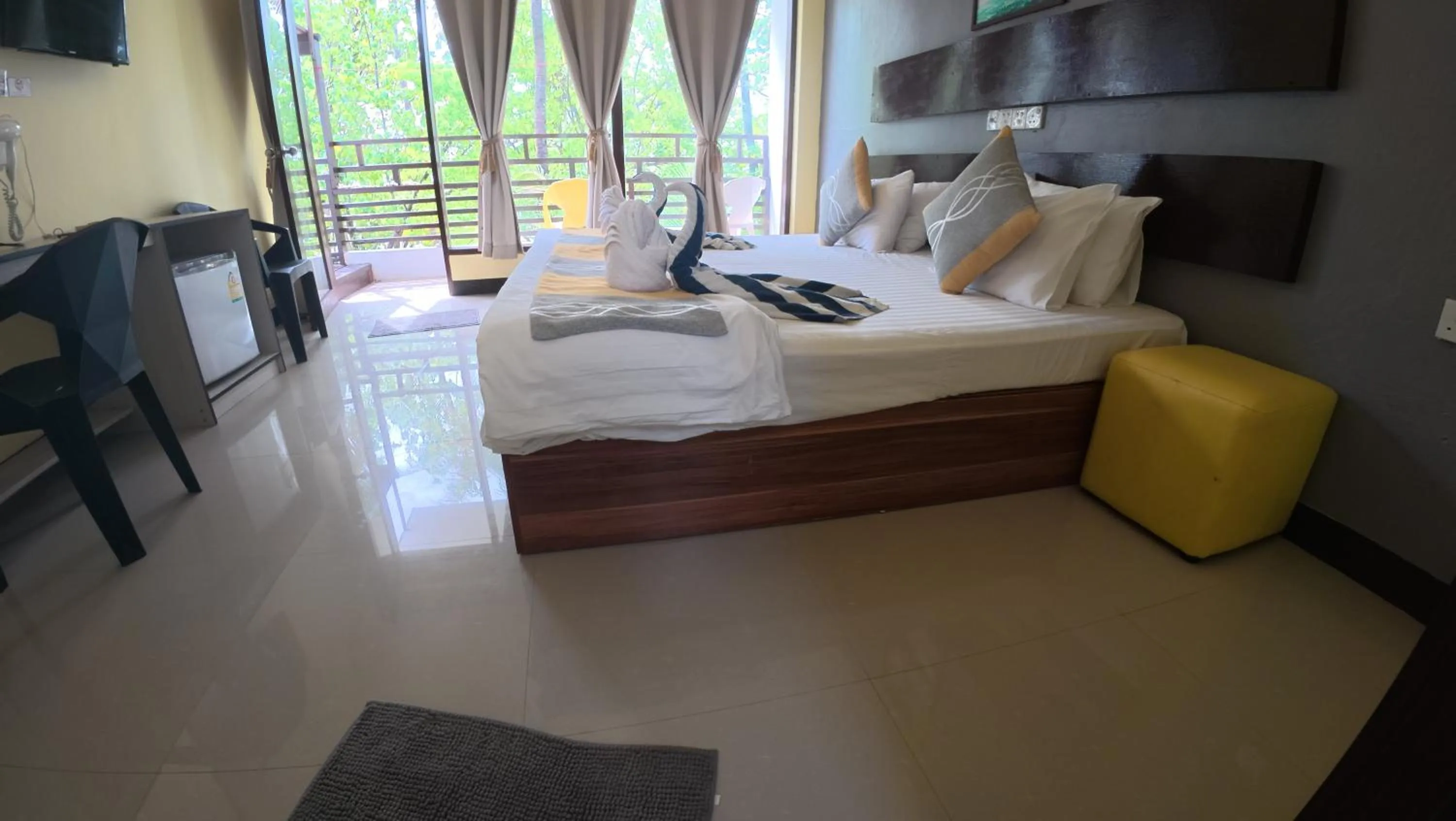 Bed in Liberty Guesthouse Maldives