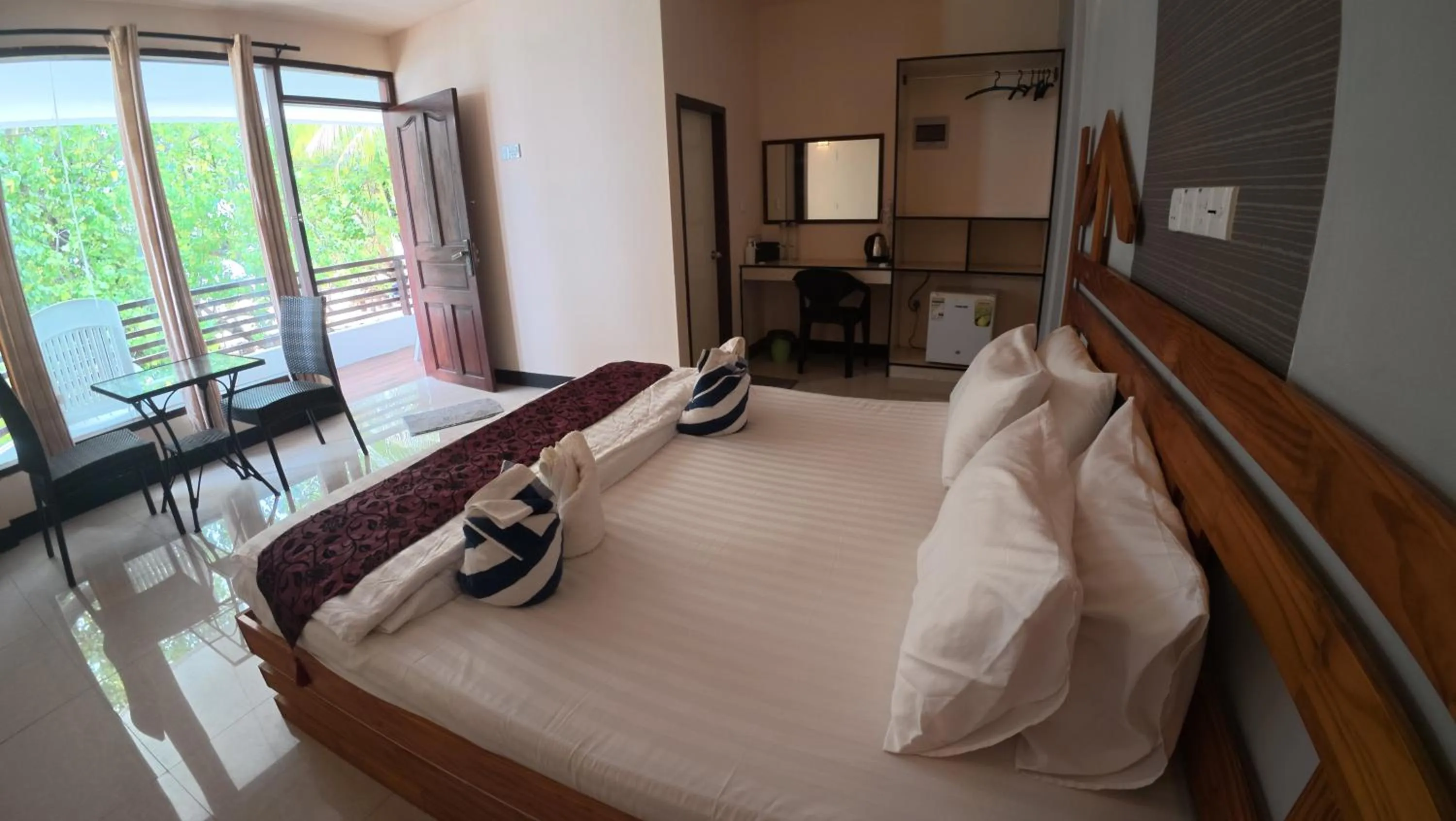 Bed in Liberty Guesthouse Maldives