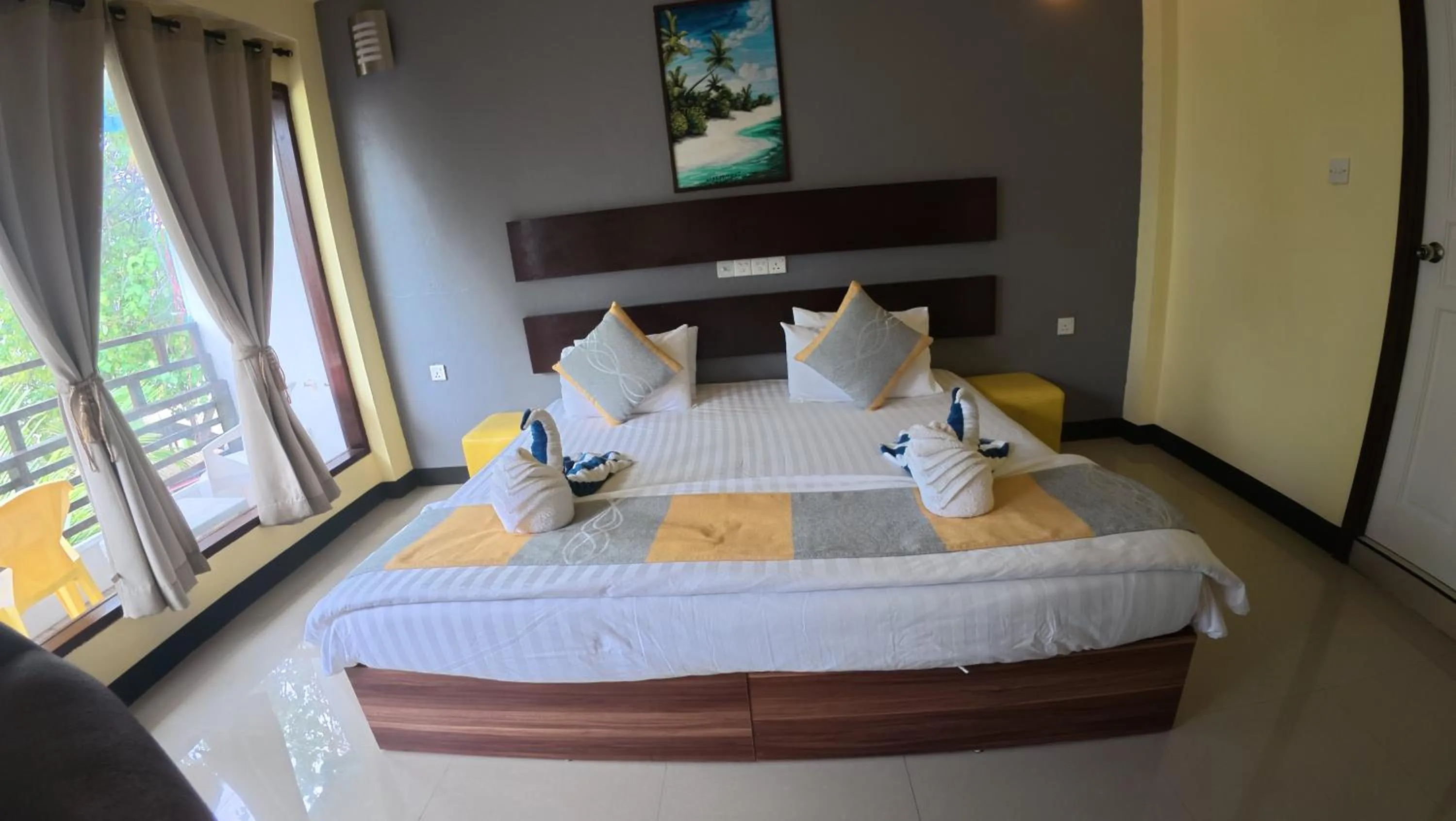 Bed in Liberty Guesthouse Maldives