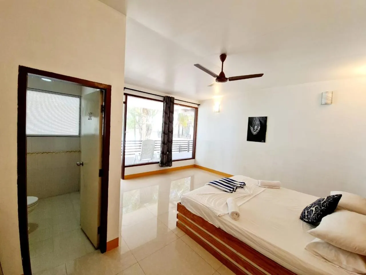 Bed in Liberty Guesthouse Maldives