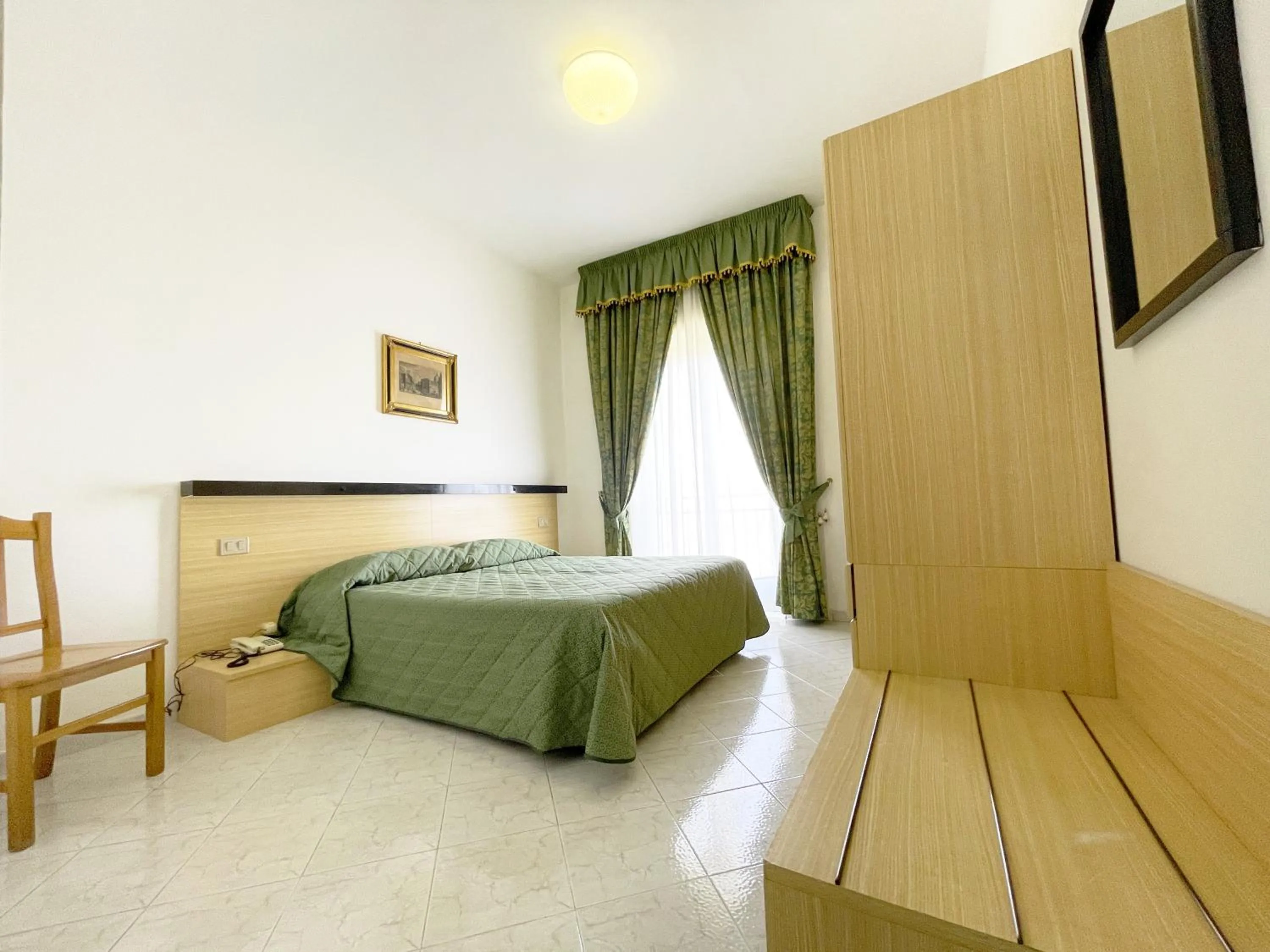 Bedroom in Hotel Reginella