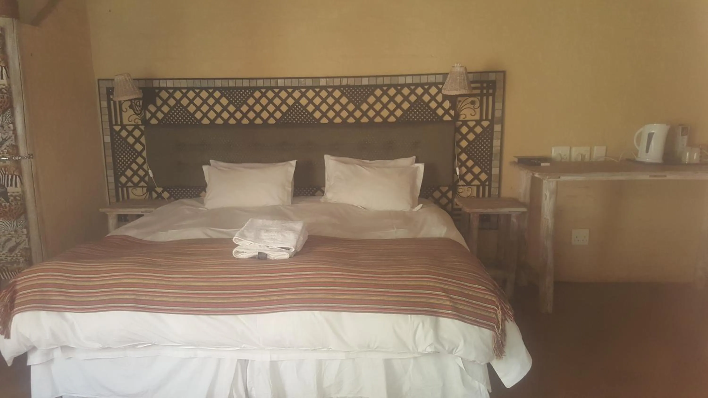 Bed in African Silhouette Guesthouse