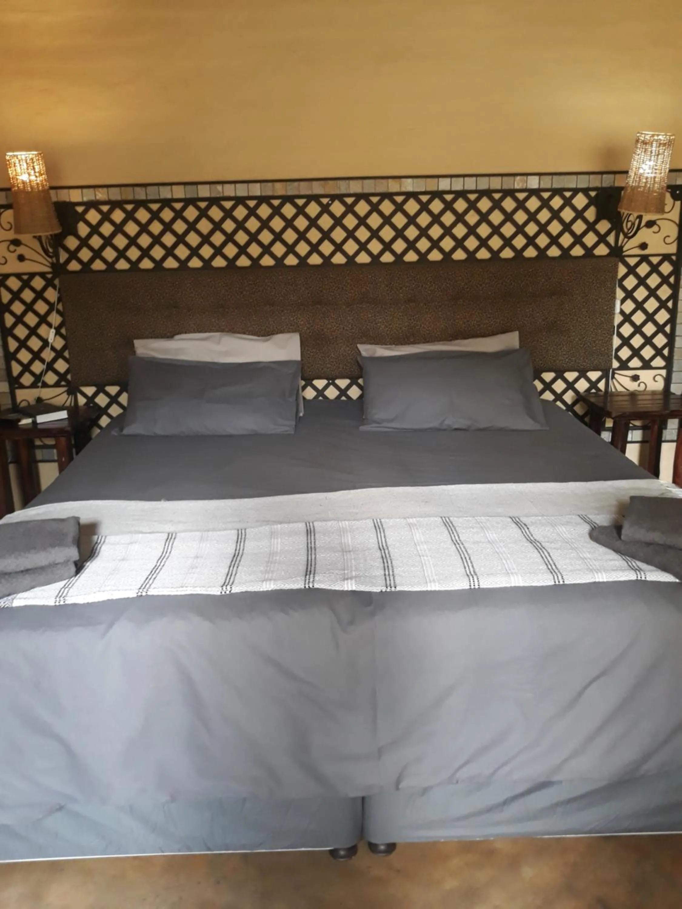 Bed in African Silhouette Guesthouse