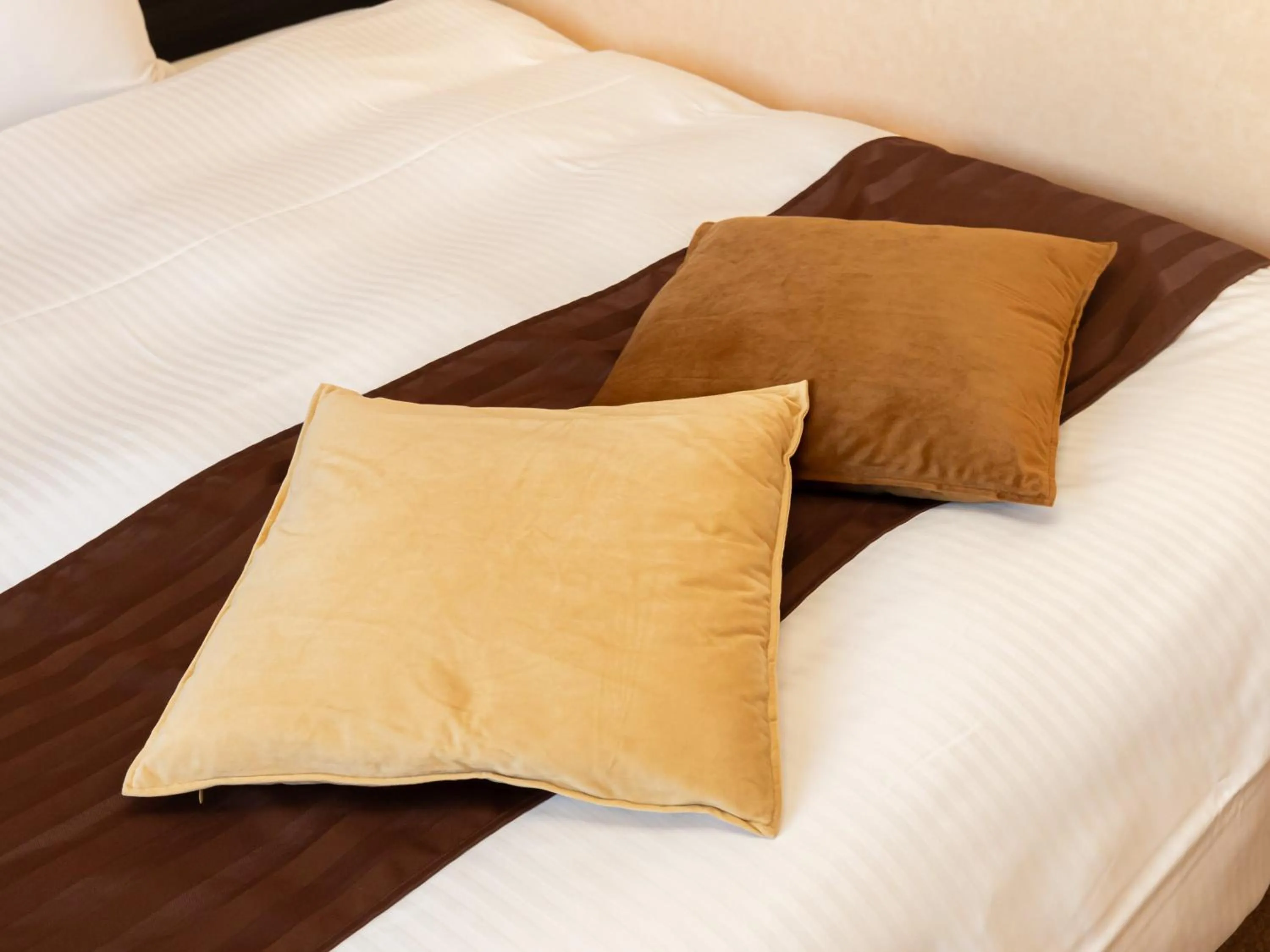 Bed in Tabist Hirosaki Touei Hotel