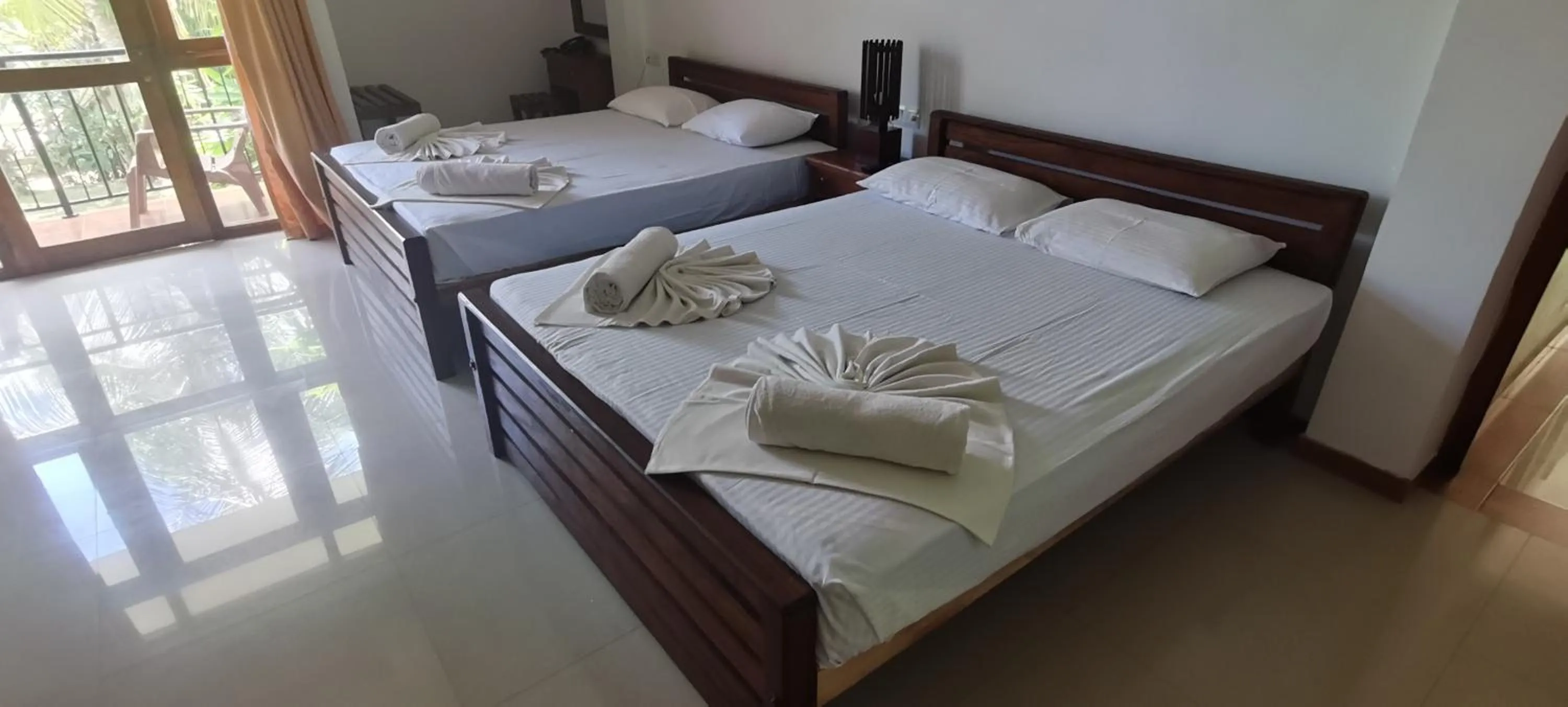 towels, Bed in Rajarata Family Resort