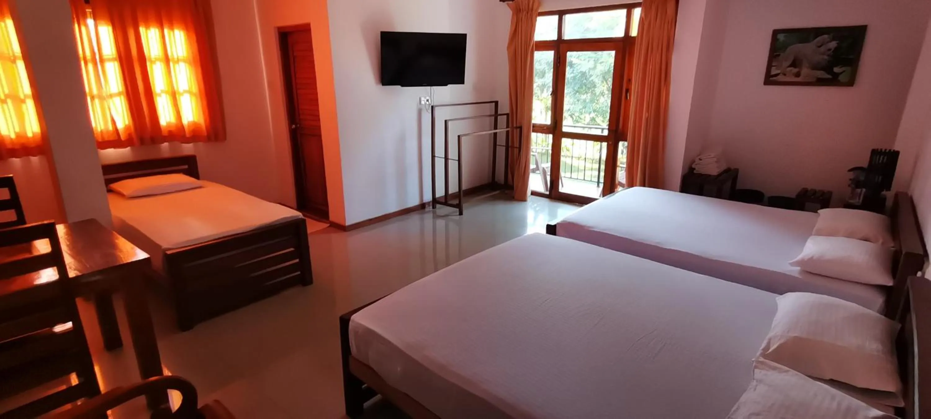 Bed in Rajarata Family Resort