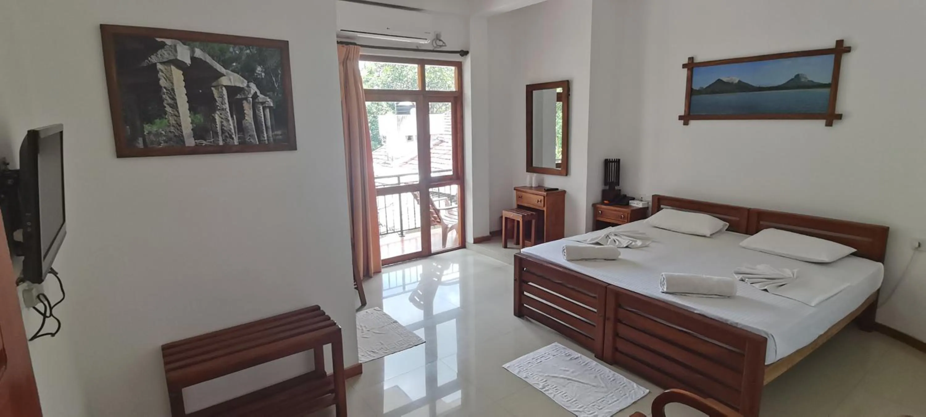Bed in Rajarata Family Resort