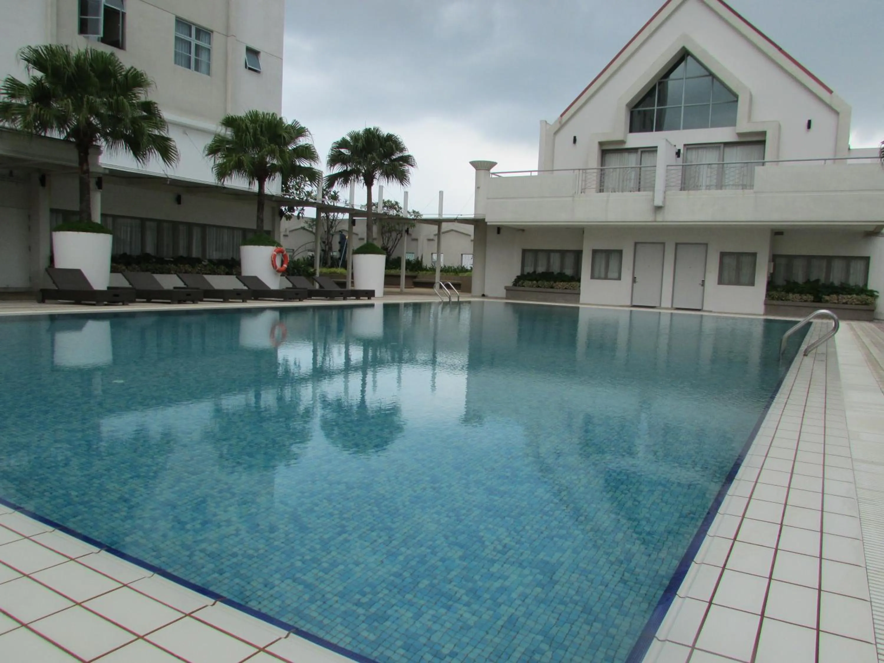 Swimming pool in Village Residence West Coast by Far East Hospitality