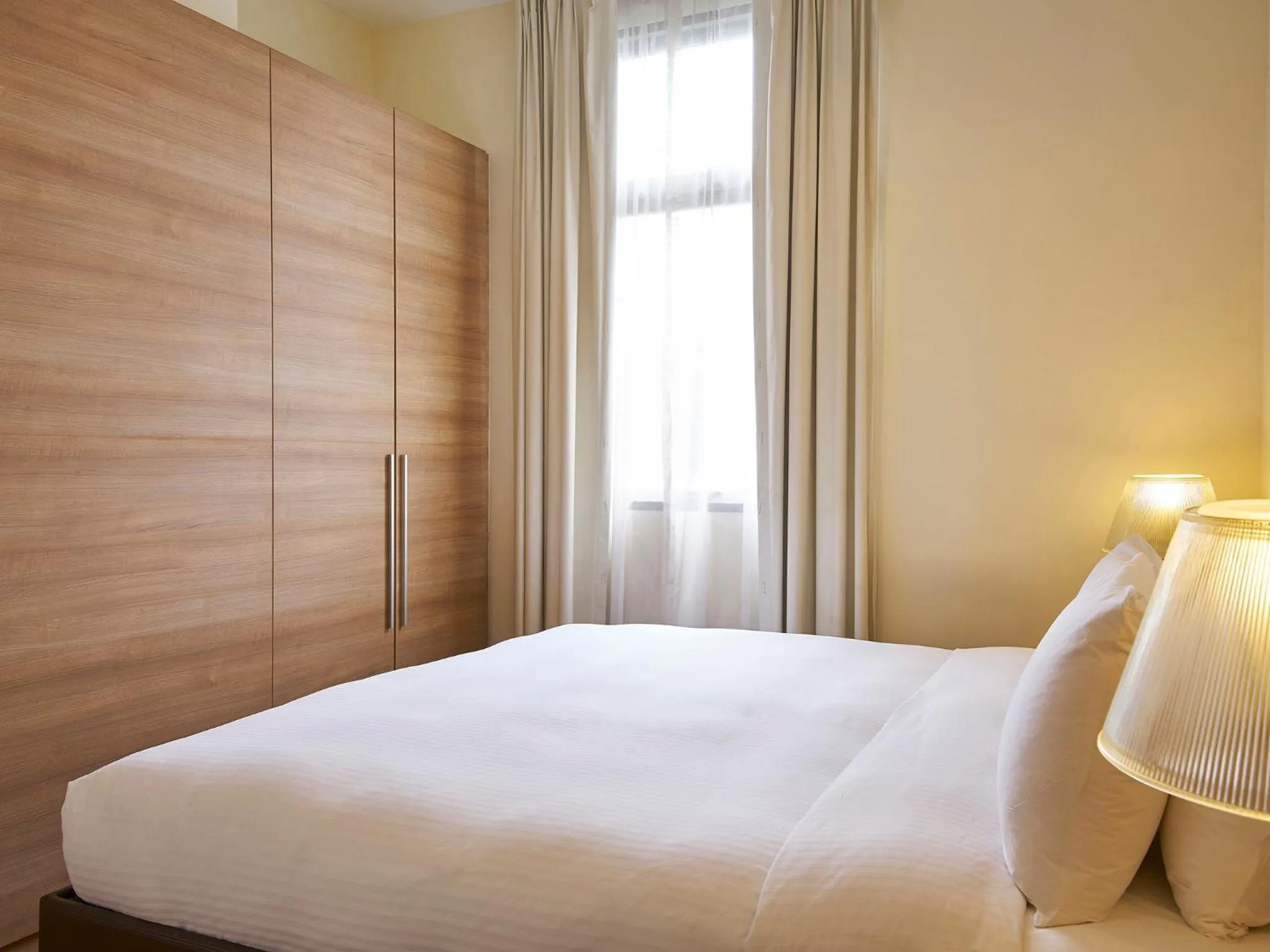 Bed in Village Residence West Coast by Far East Hospitality