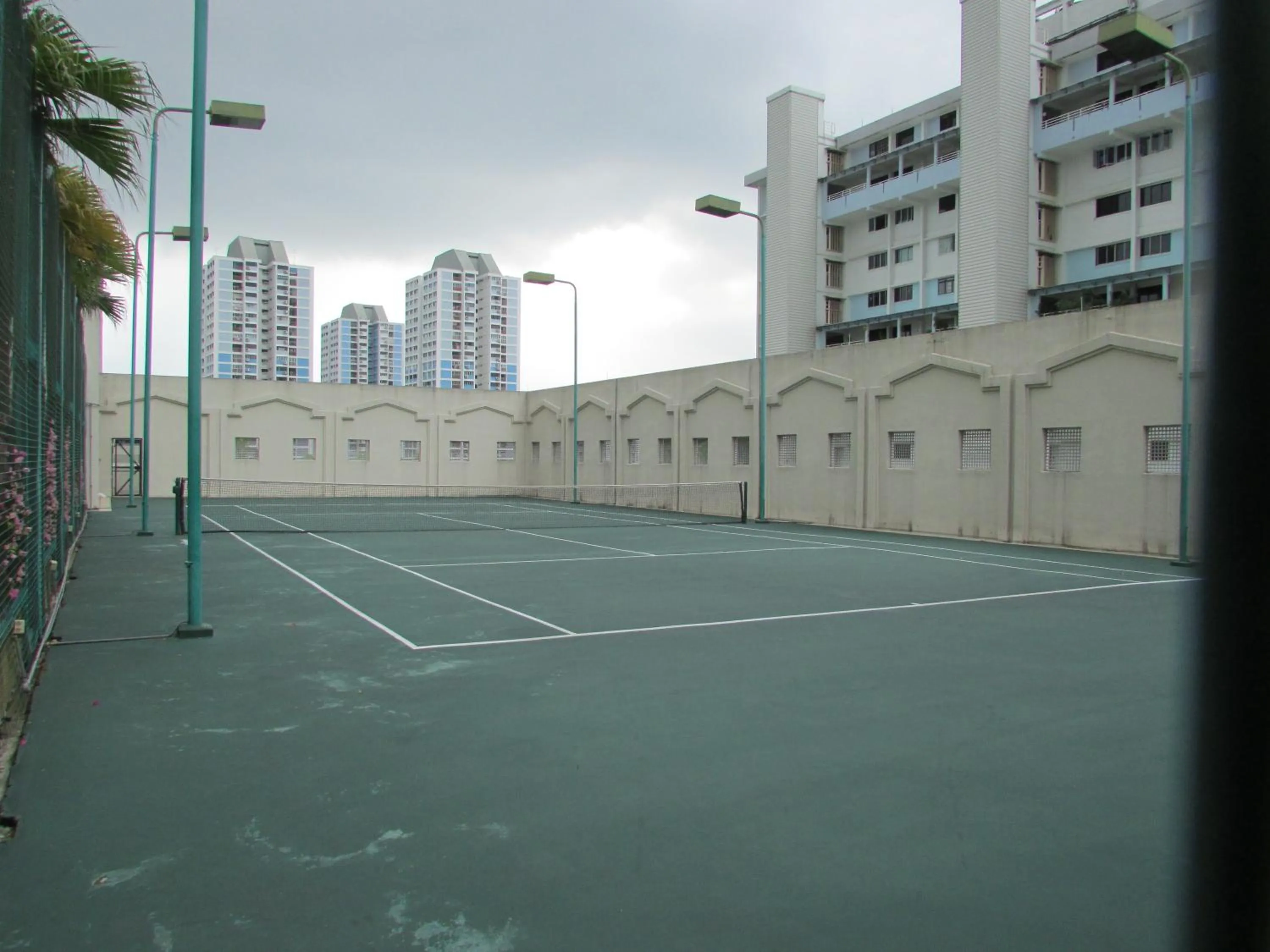 Tennis court in Village Residence West Coast by Far East Hospitality