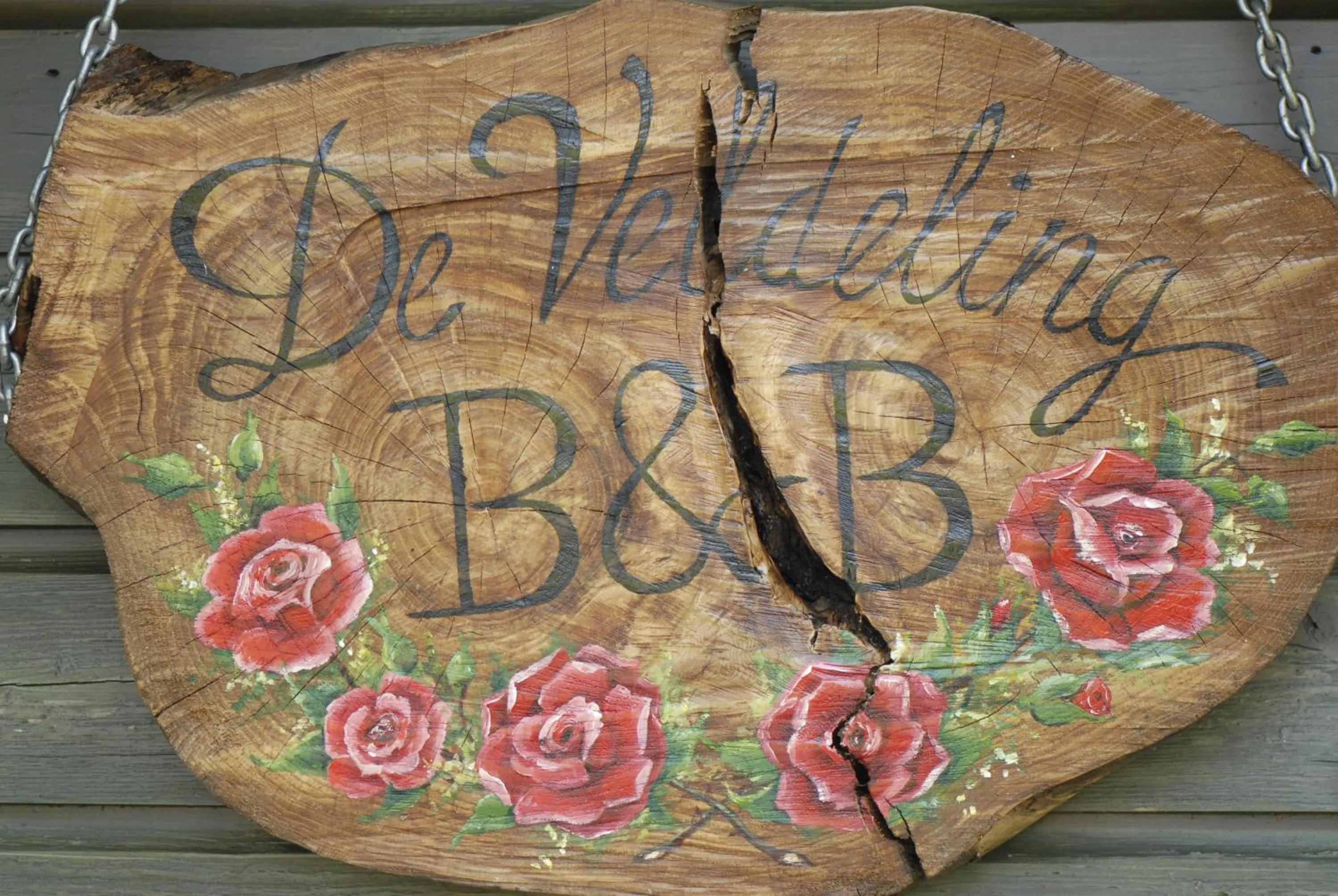 Property logo or sign in De Veldeling