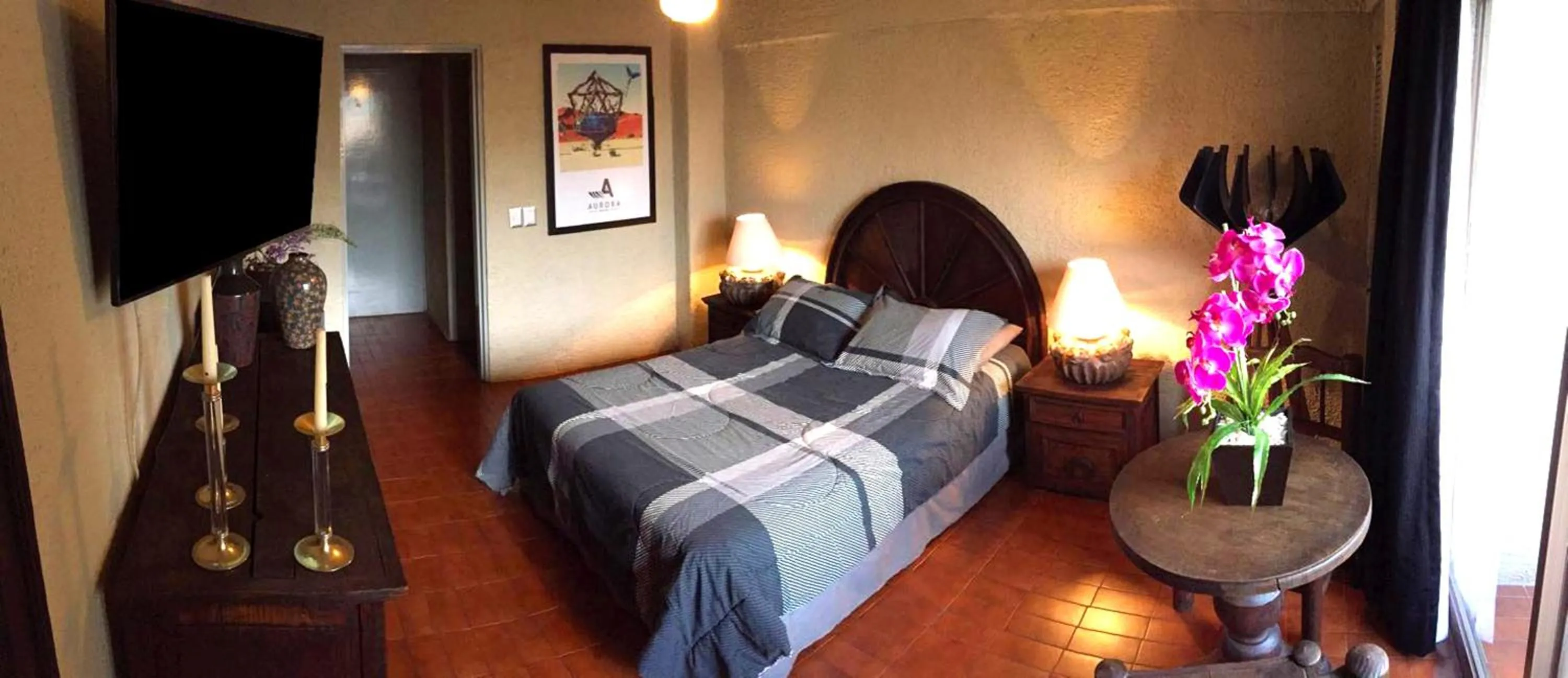 Photo of the whole room, Bed in Aurora Suites