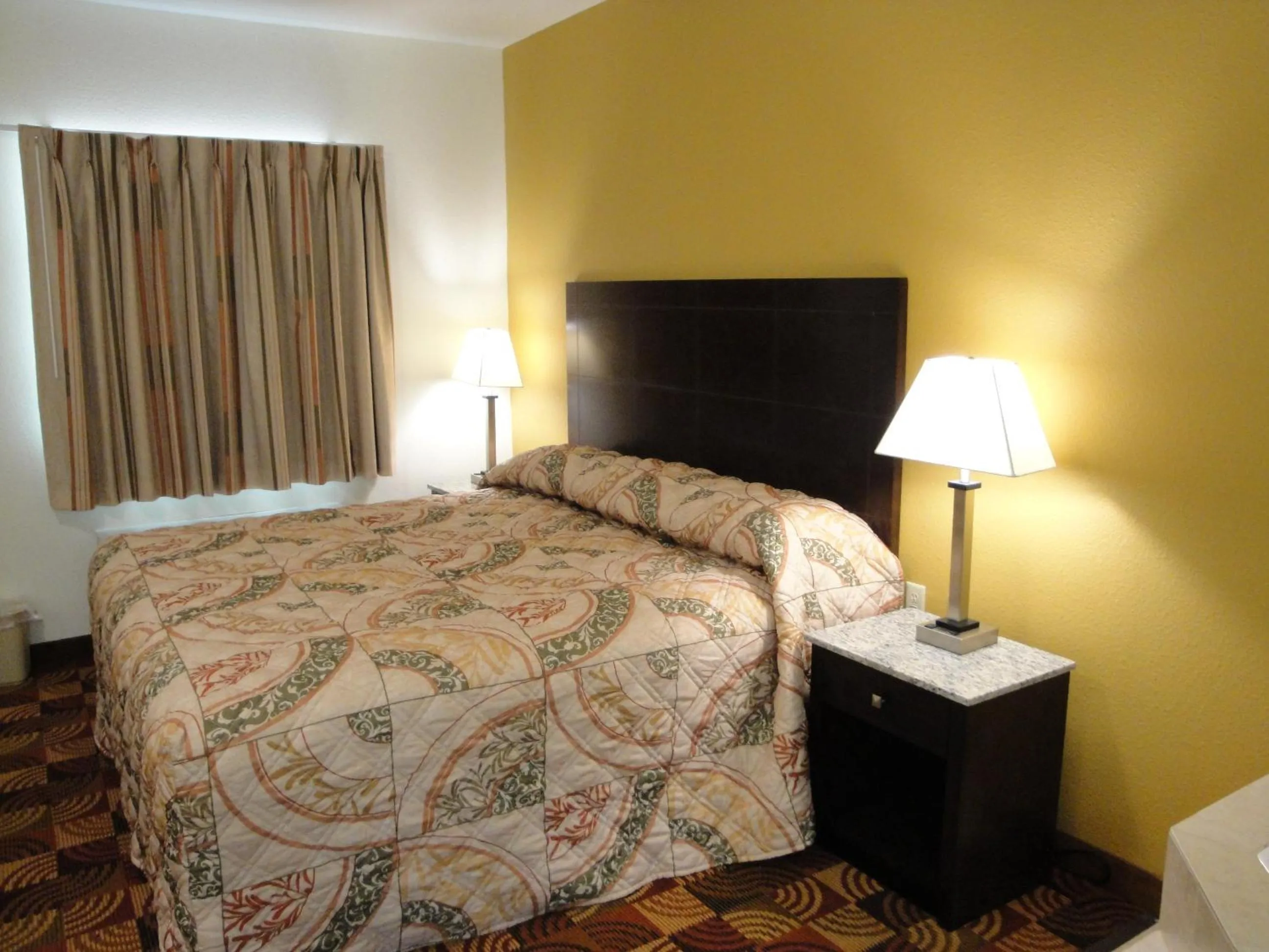 Bed in Sands Inn & Suites