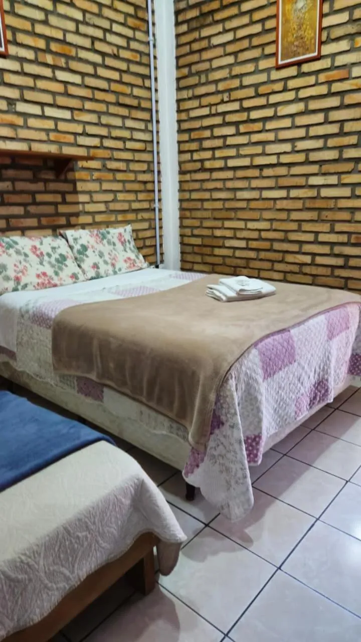 Bed in Pousada Marujo