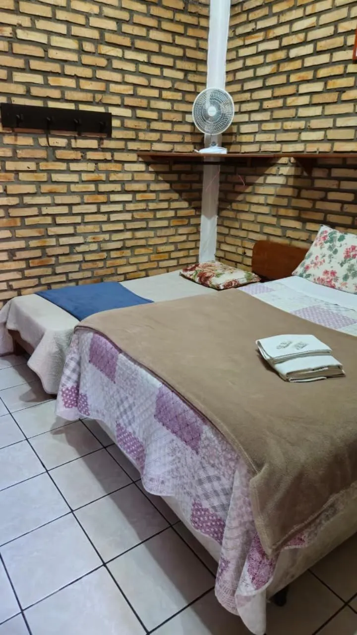 Bed in Pousada Marujo