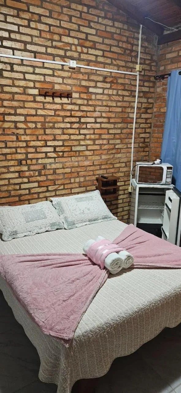 Bed in Pousada Marujo