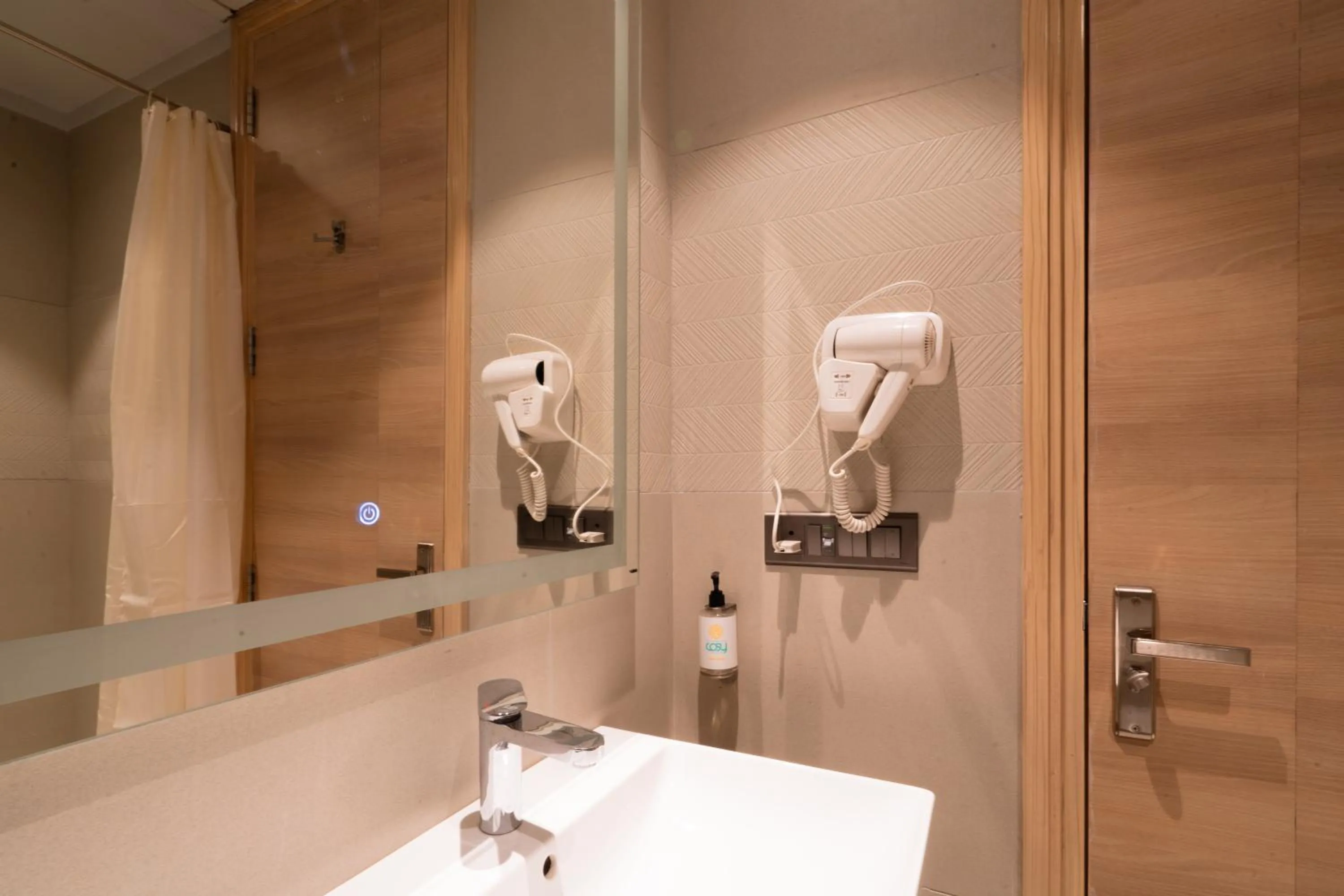 Shower in Hotel Bluestone Prime Nehru Place by The Cosy hotels