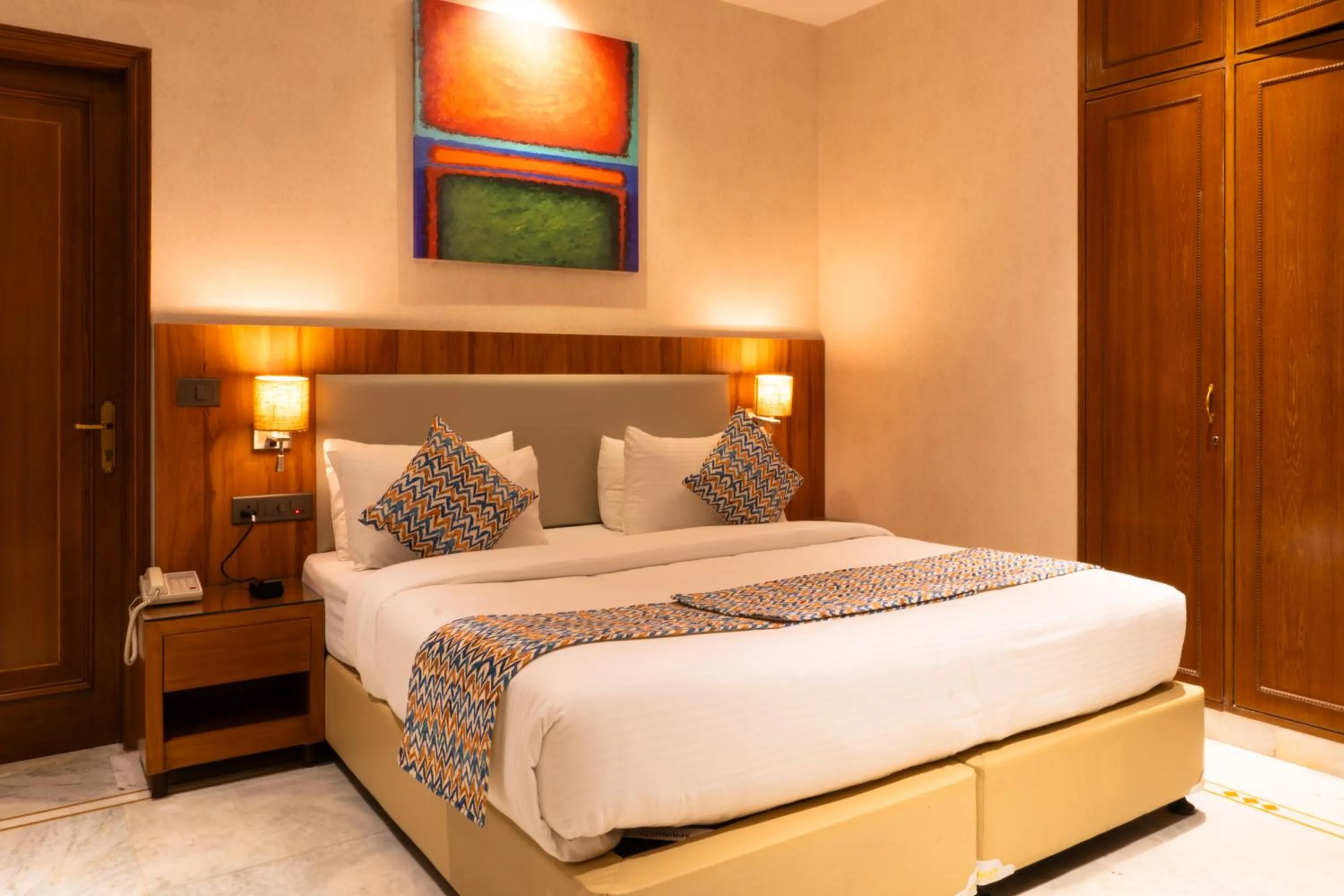 Photo of the whole room, Bed in Hotel Bluestone Prime Nehru Place by The Cosy hotels