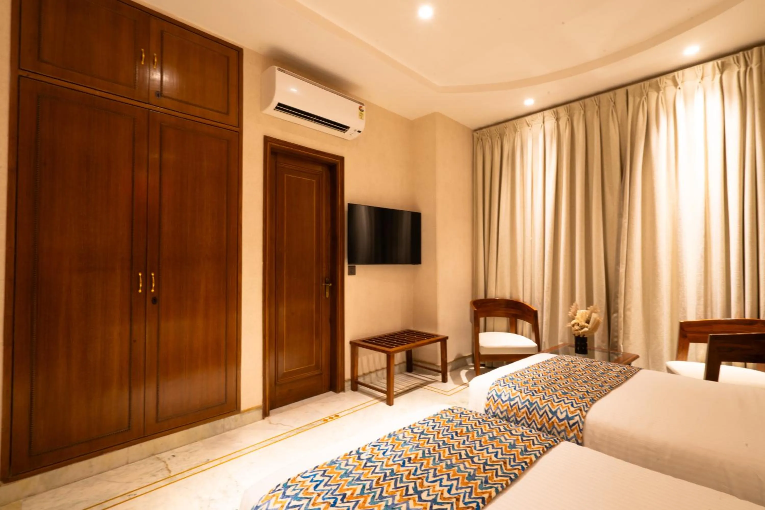 Photo of the whole room, Bed in Hotel Bluestone Prime Nehru Place by The Cosy hotels