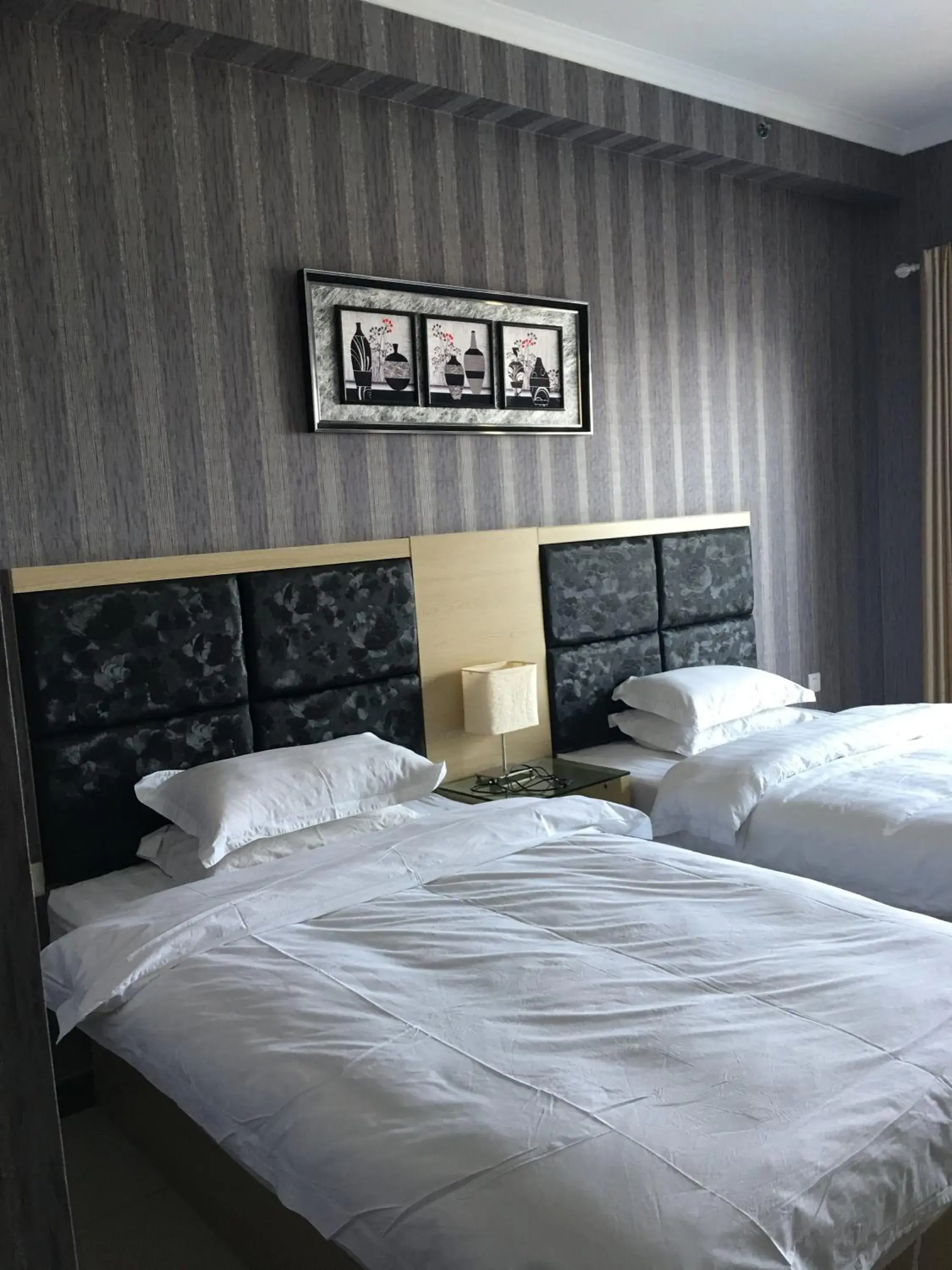 Decorative detail, Bed in Xizhengjia Apartment Hotel Pazhou Complex Decorative detail, Bed in Xizhengjia Apartment Hotel Pazhou Complex