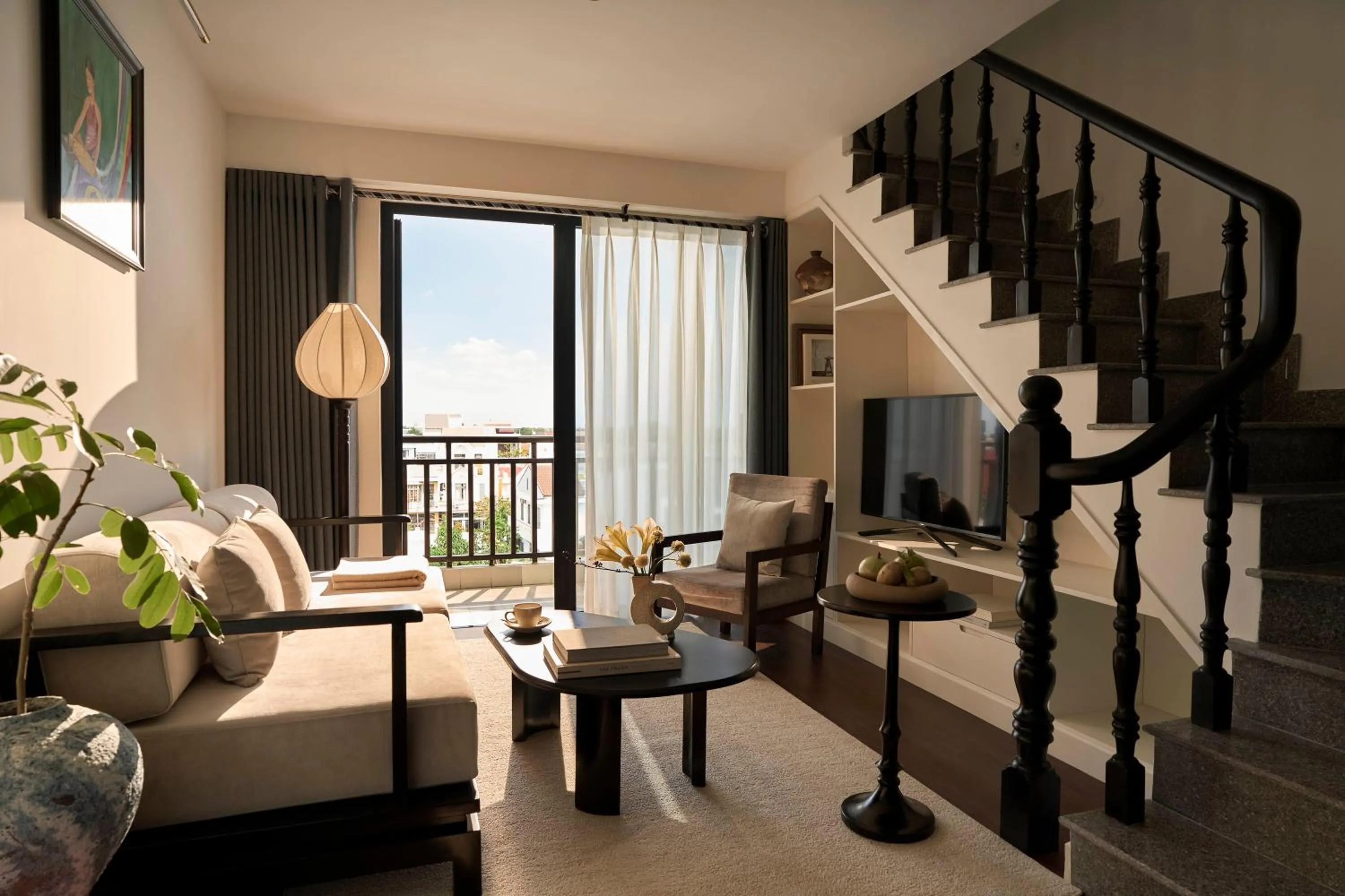 Communal lounge/ TV room in Grand Signature By M Village Hoi An Resort
