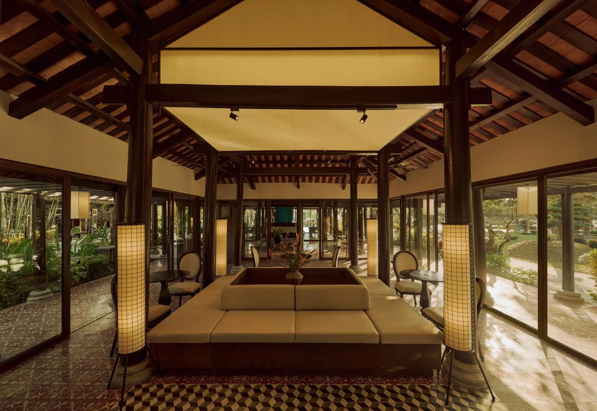 Seating area, Bed in Grand Signature By M Village Hoi An Resort