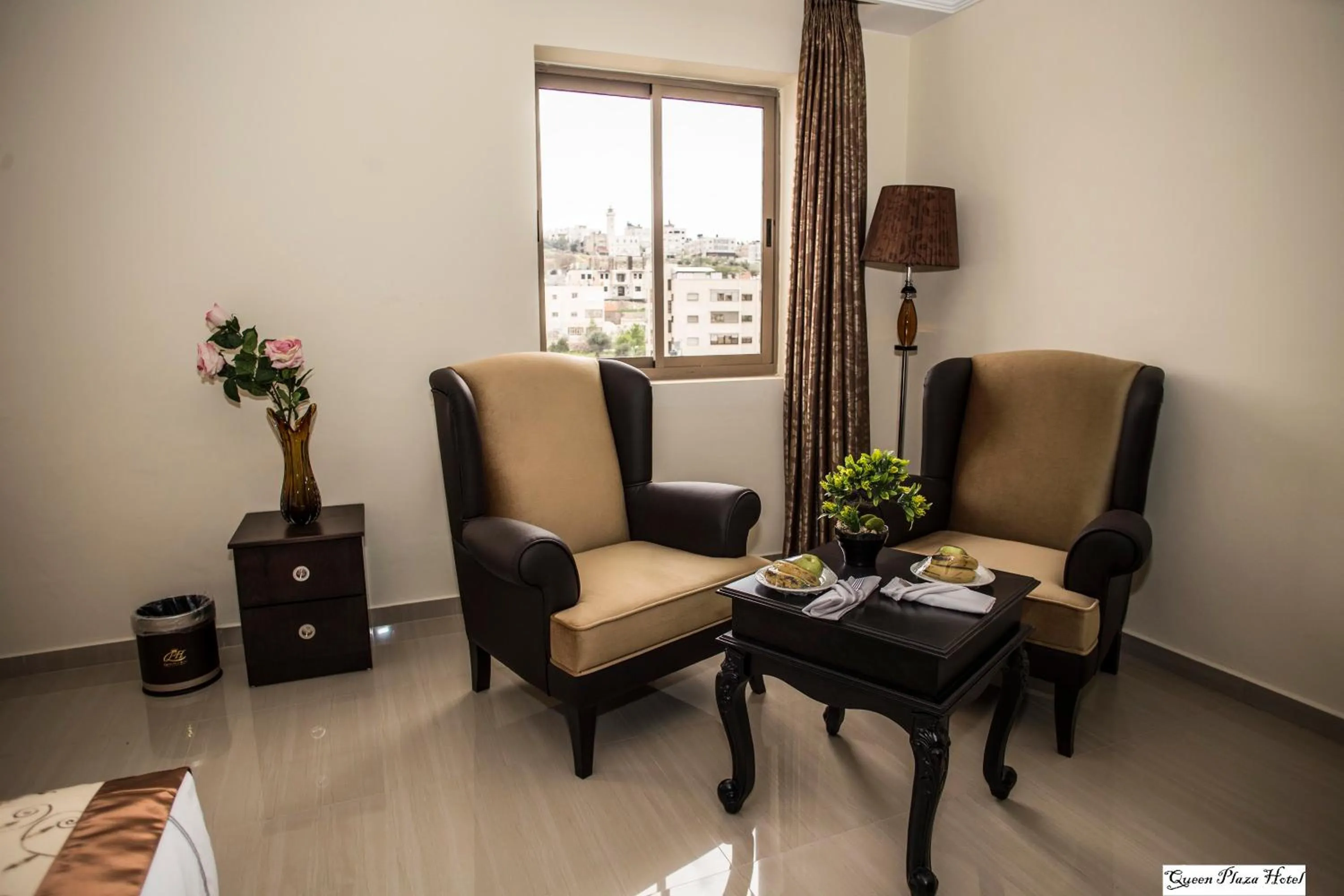 Bedroom in Queen Plaza Hotel