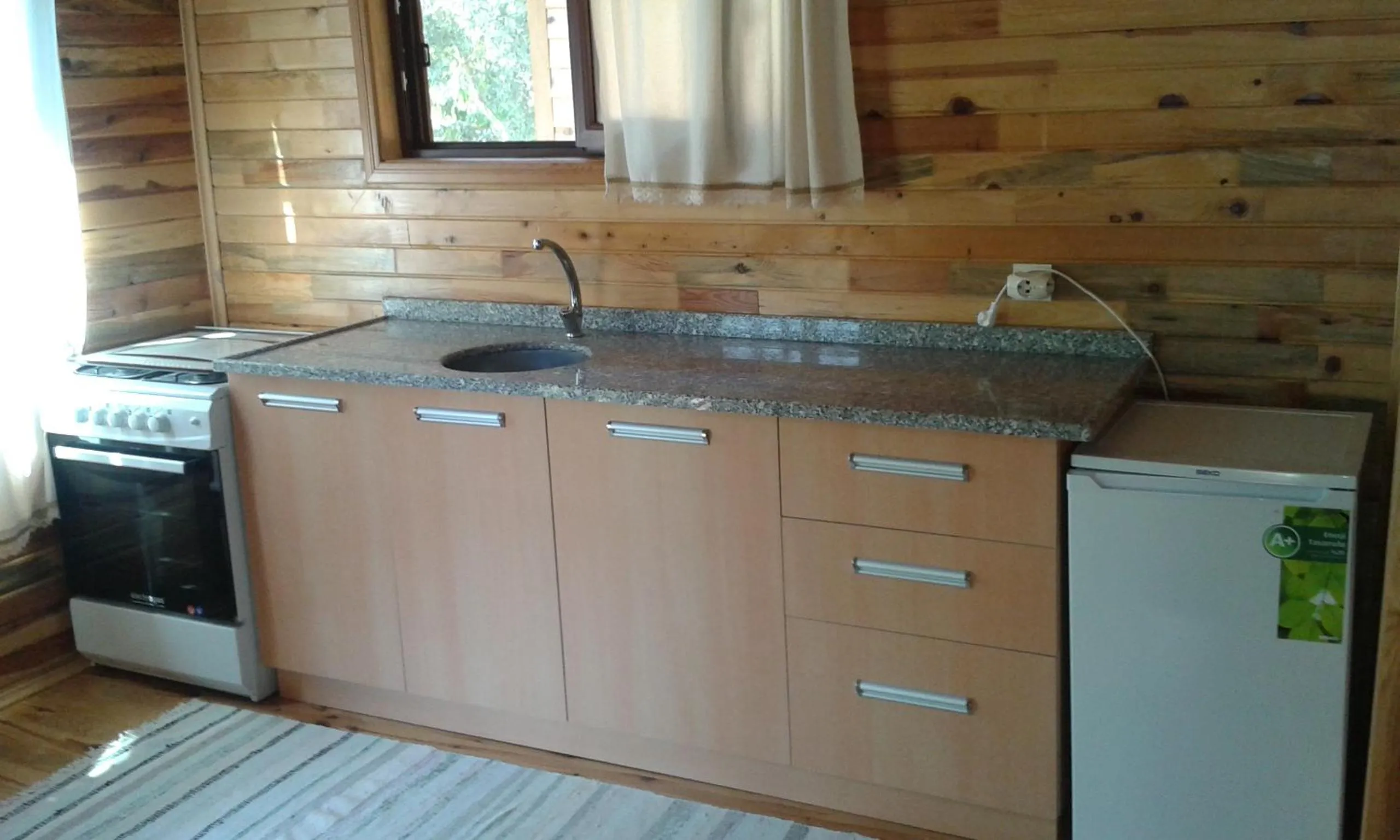 Kitchen or kitchenette in Bungalow Halil