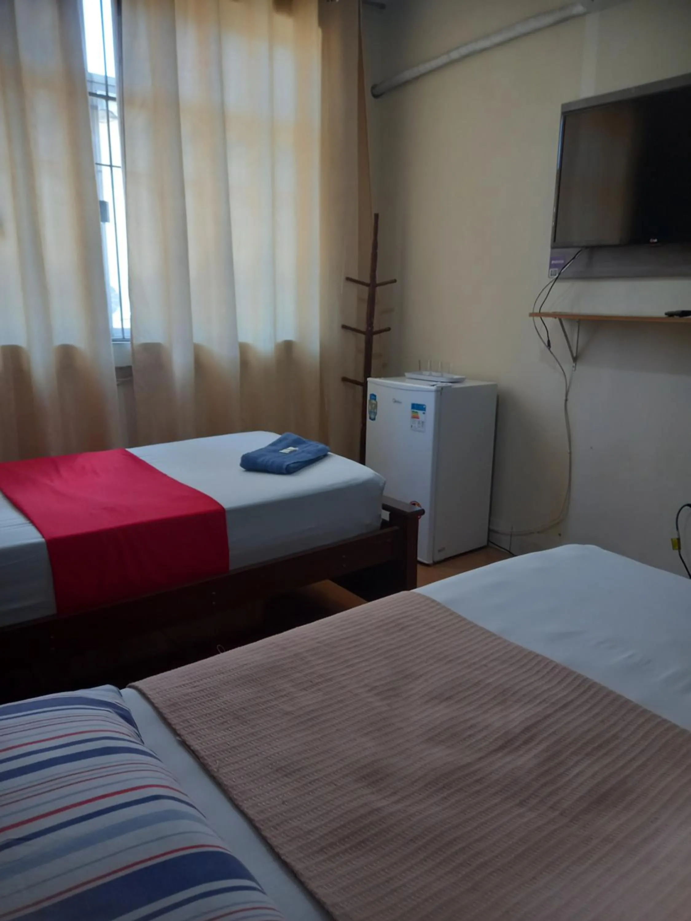 View (from property/room), Bed in Quartos Em Casa In Caxias da Paraíso
