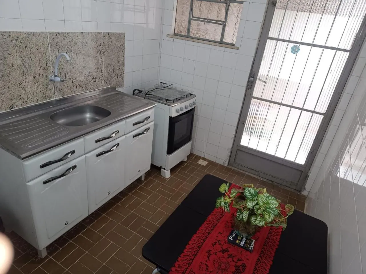 Kitchen or kitchenette in Quartos Em Casa In Caxias da Paraíso