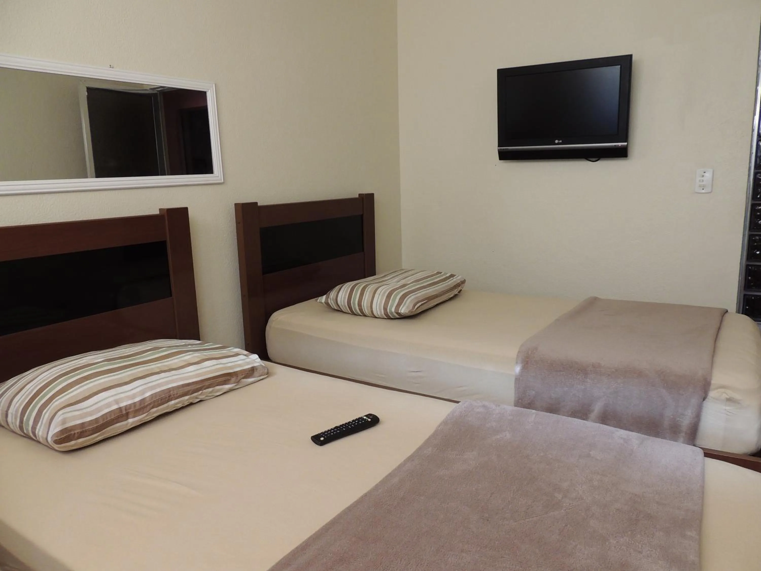 Bed in Quartos Em Casa In Caxias da Paraíso