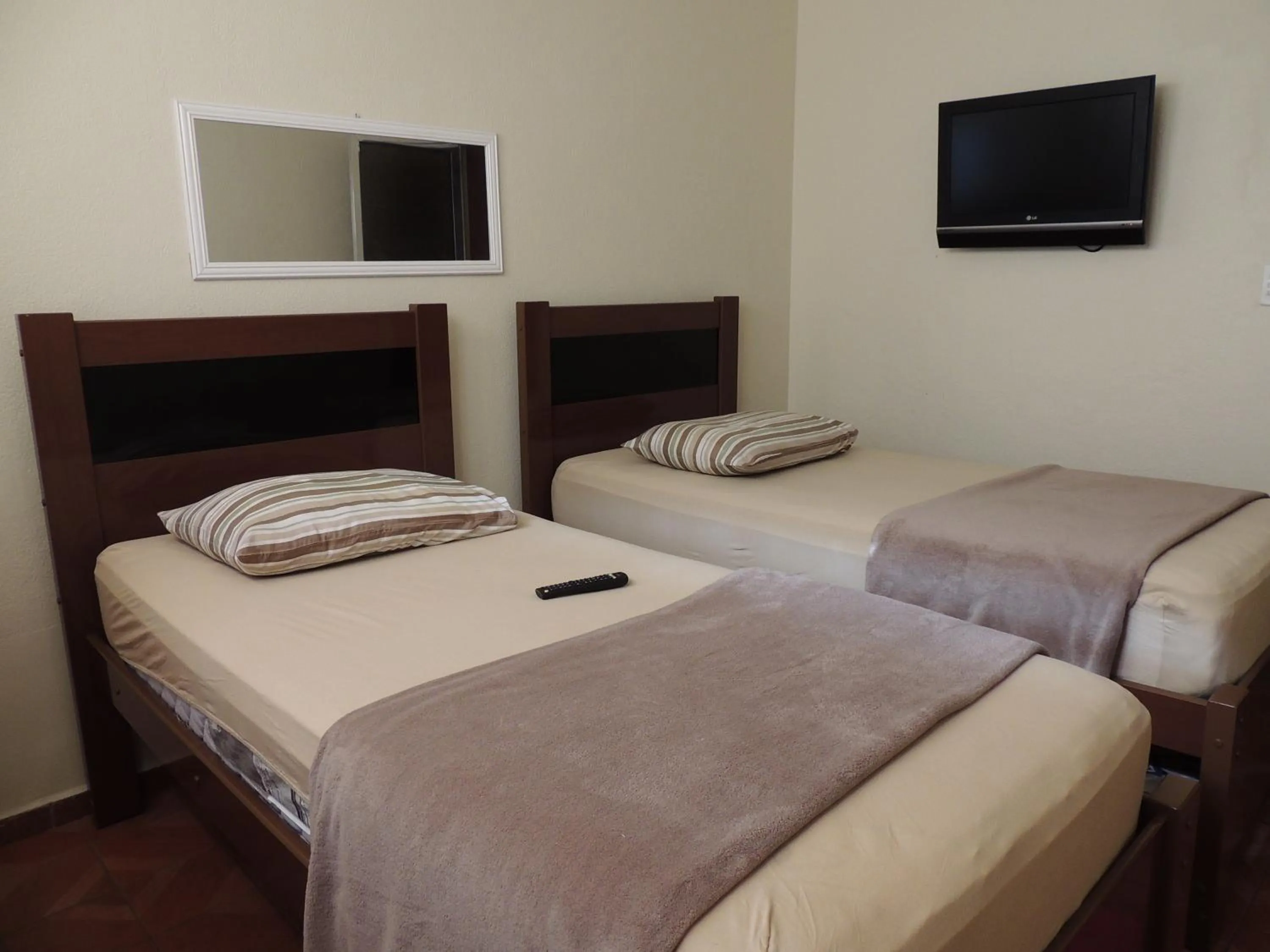 Bed in Quartos Em Casa In Caxias da Paraíso