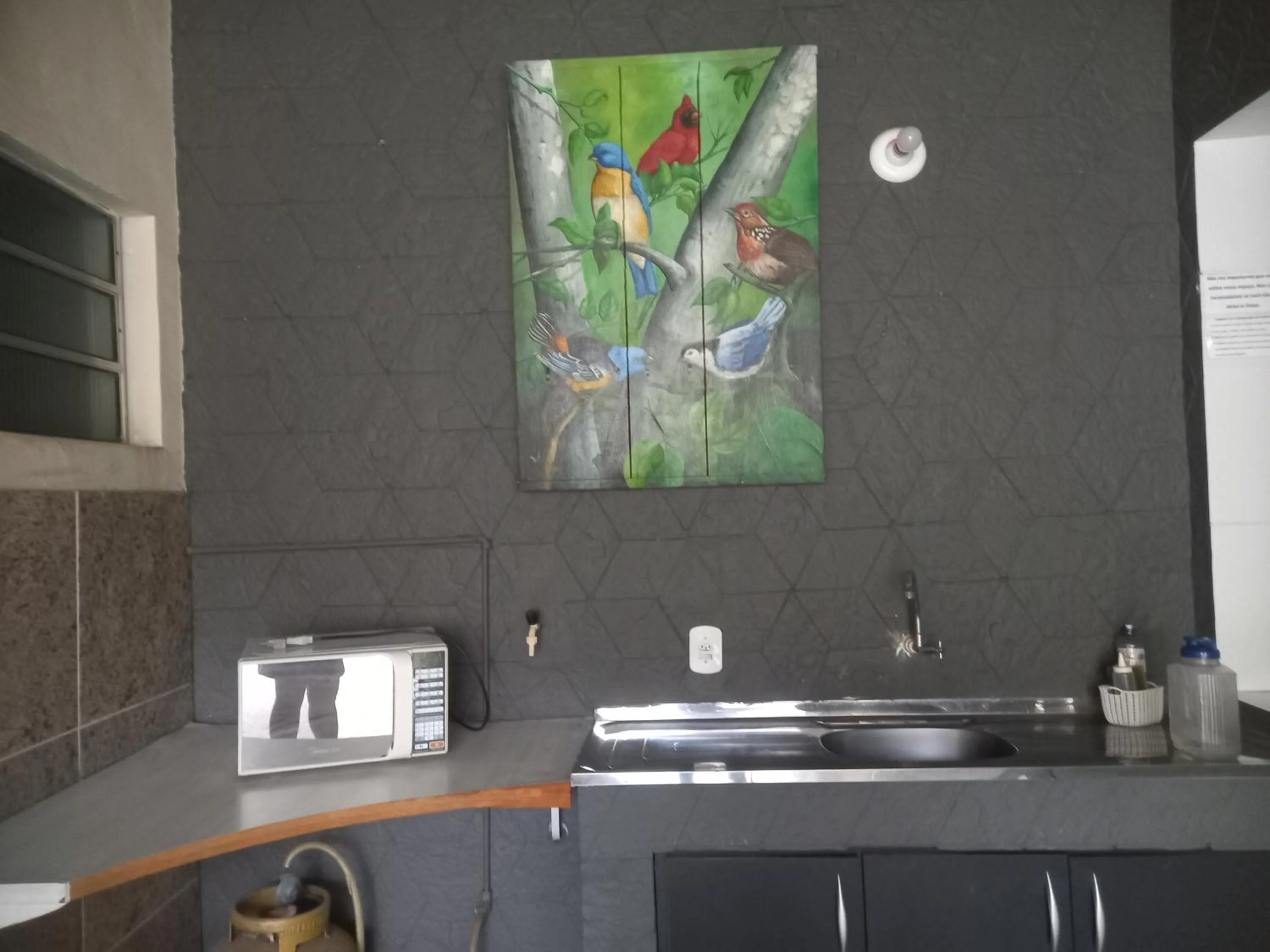 Kitchen or kitchenette in Quartos Em Casa In Caxias da Paraíso