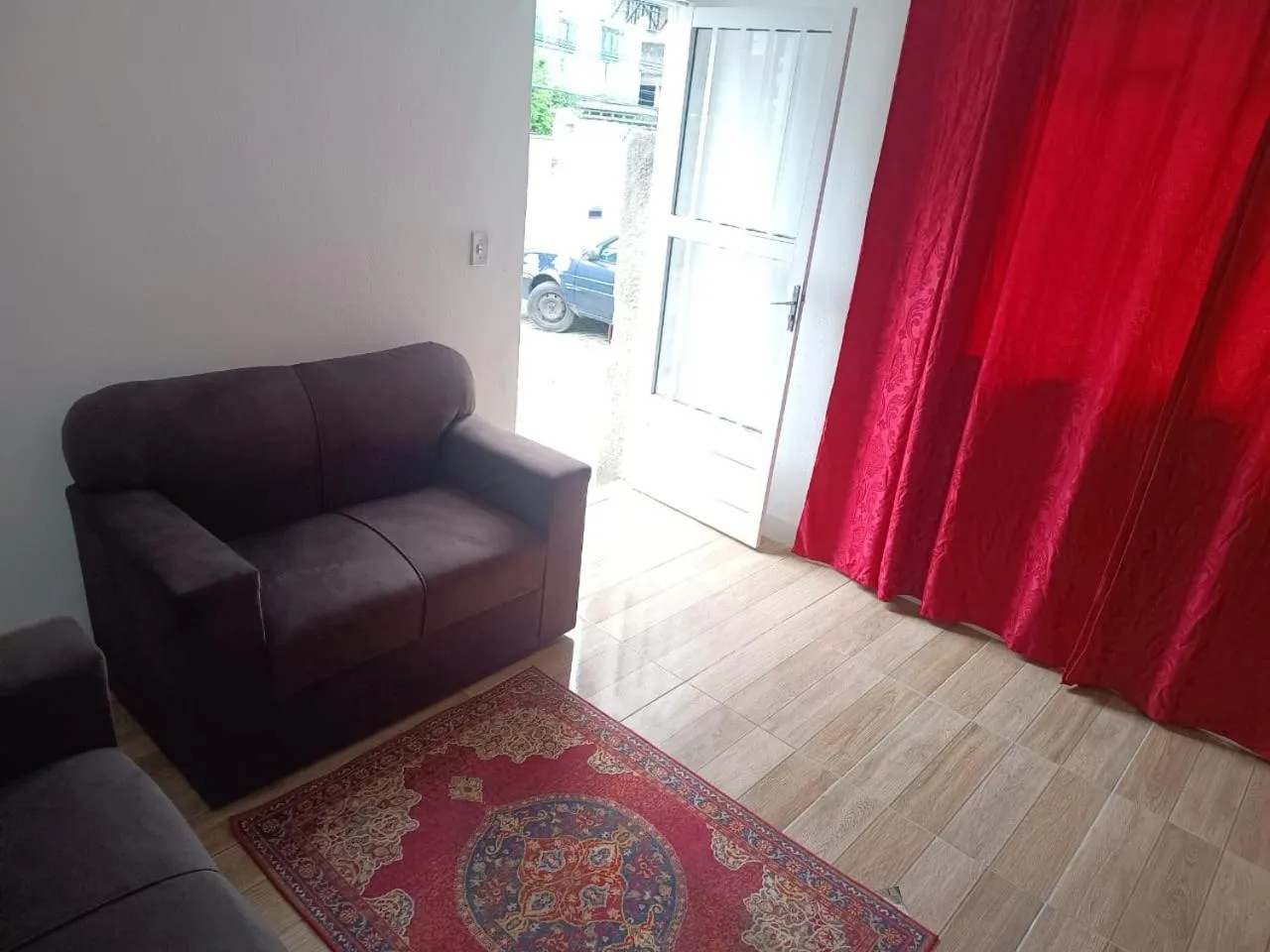 Living room in Quartos Em Casa In Caxias da Paraíso