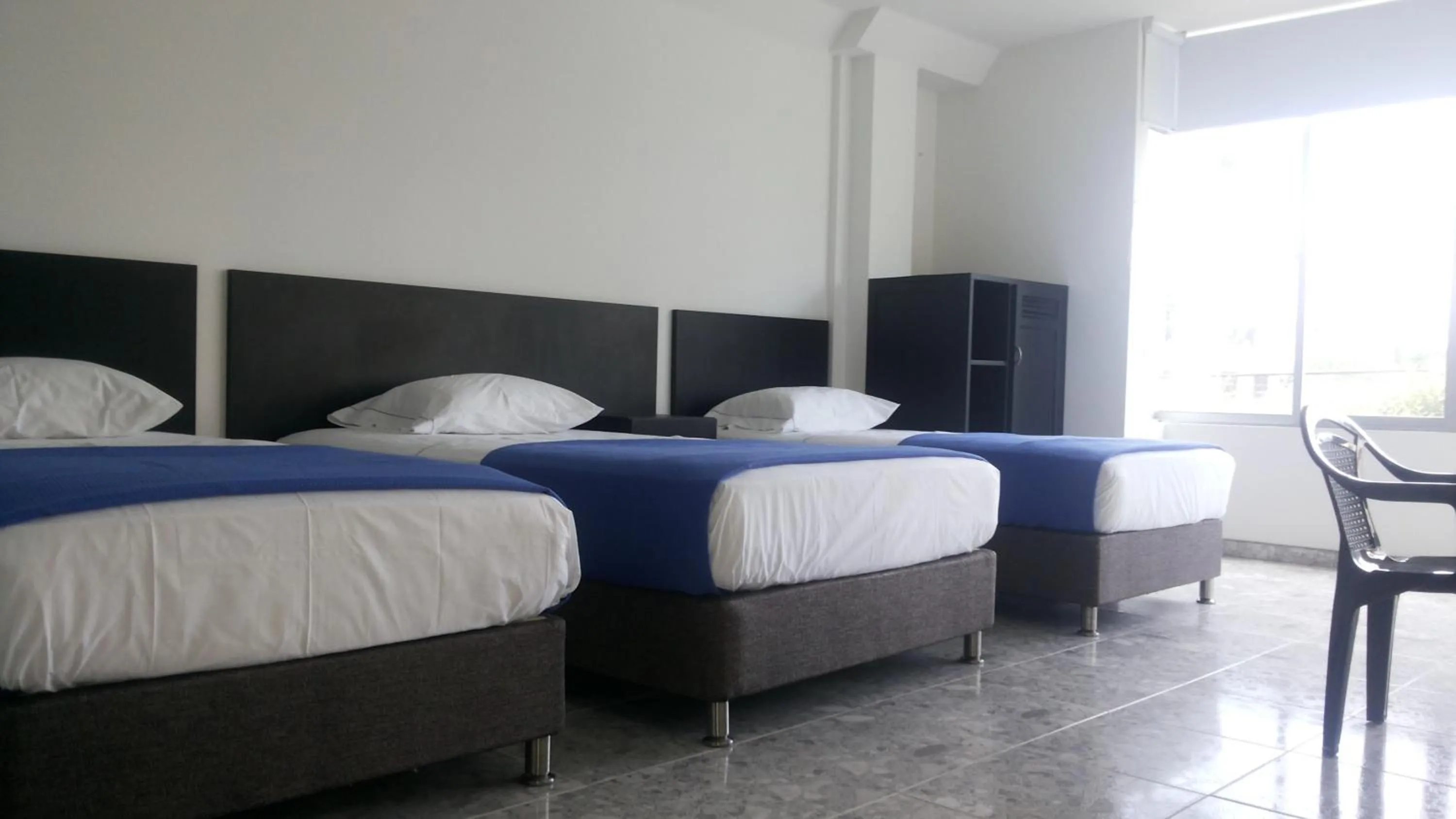 Bed in Hotel Bucare