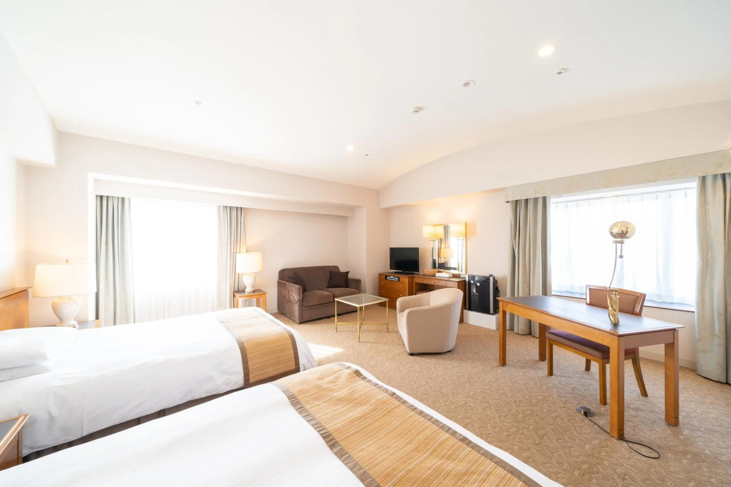 Living room, Bed in Hotel Terrace The Square Hitachi