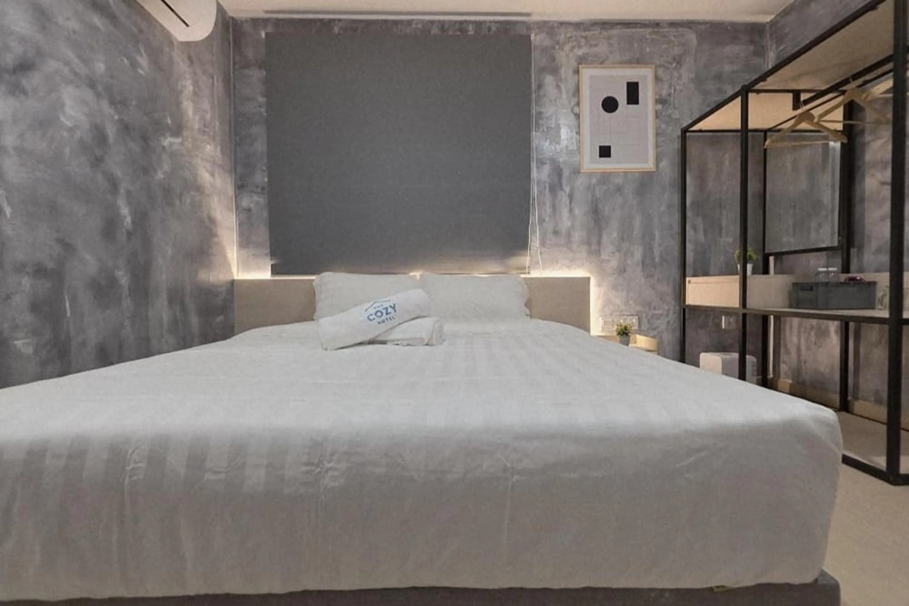 Bed in The Cozy Hotel